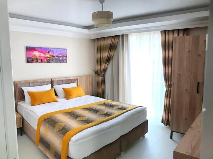 Bed in Alfa Apart Hotel