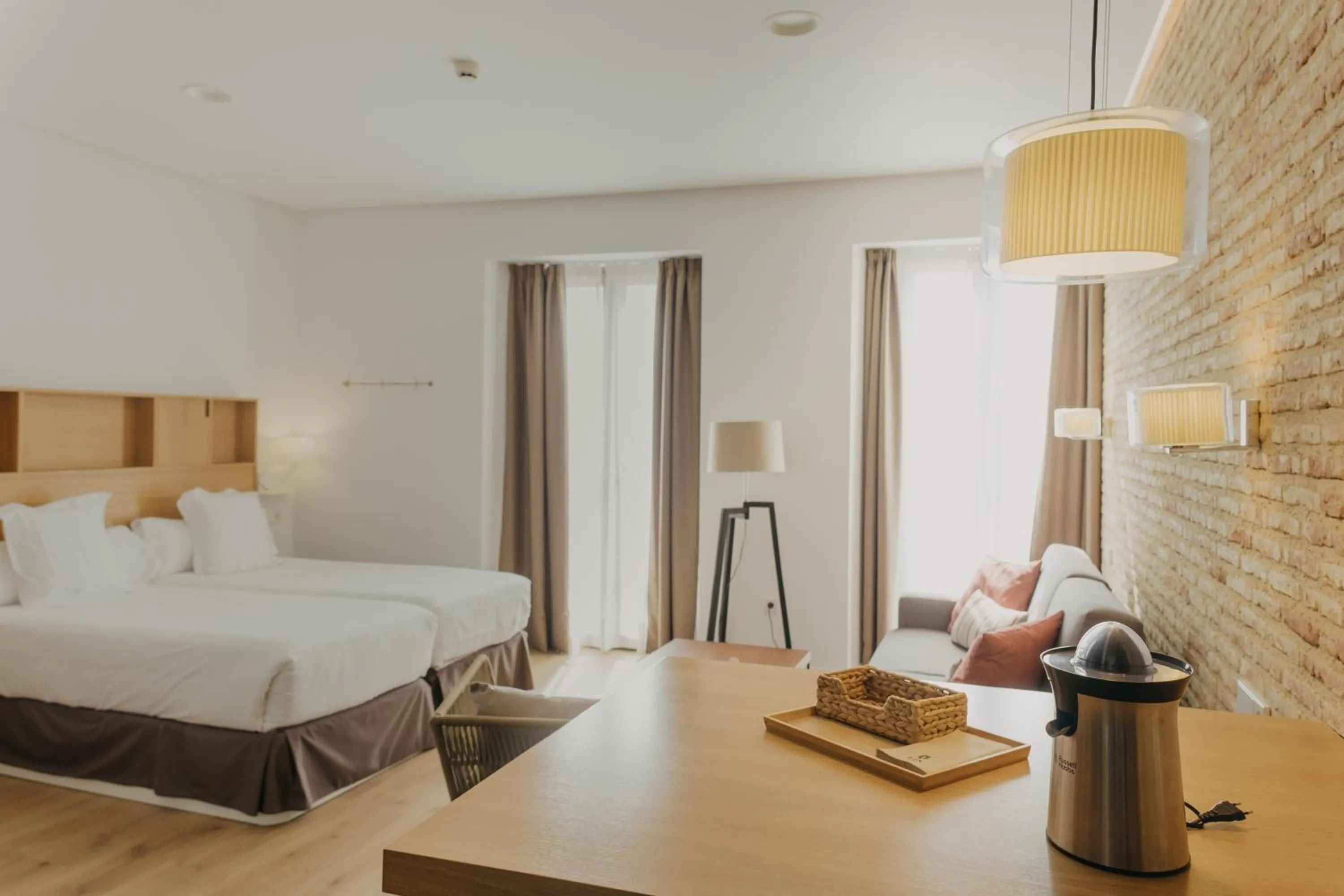 Bed in Aquitania Home Suites