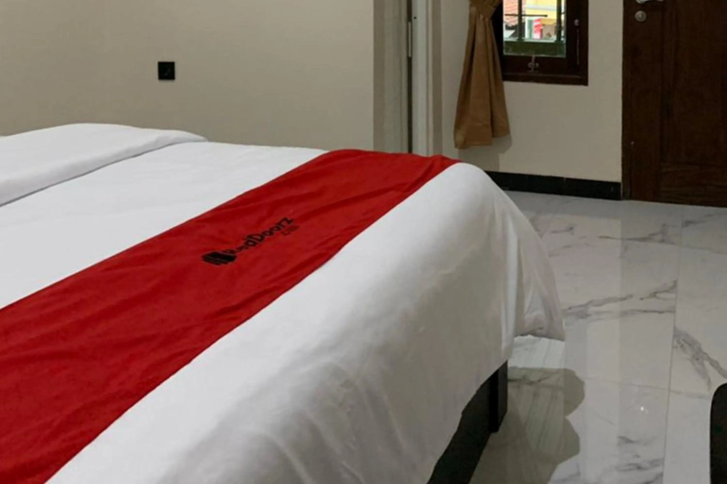Bed in RedDoorz Syariah near Kawasan Simpang Lima Pati