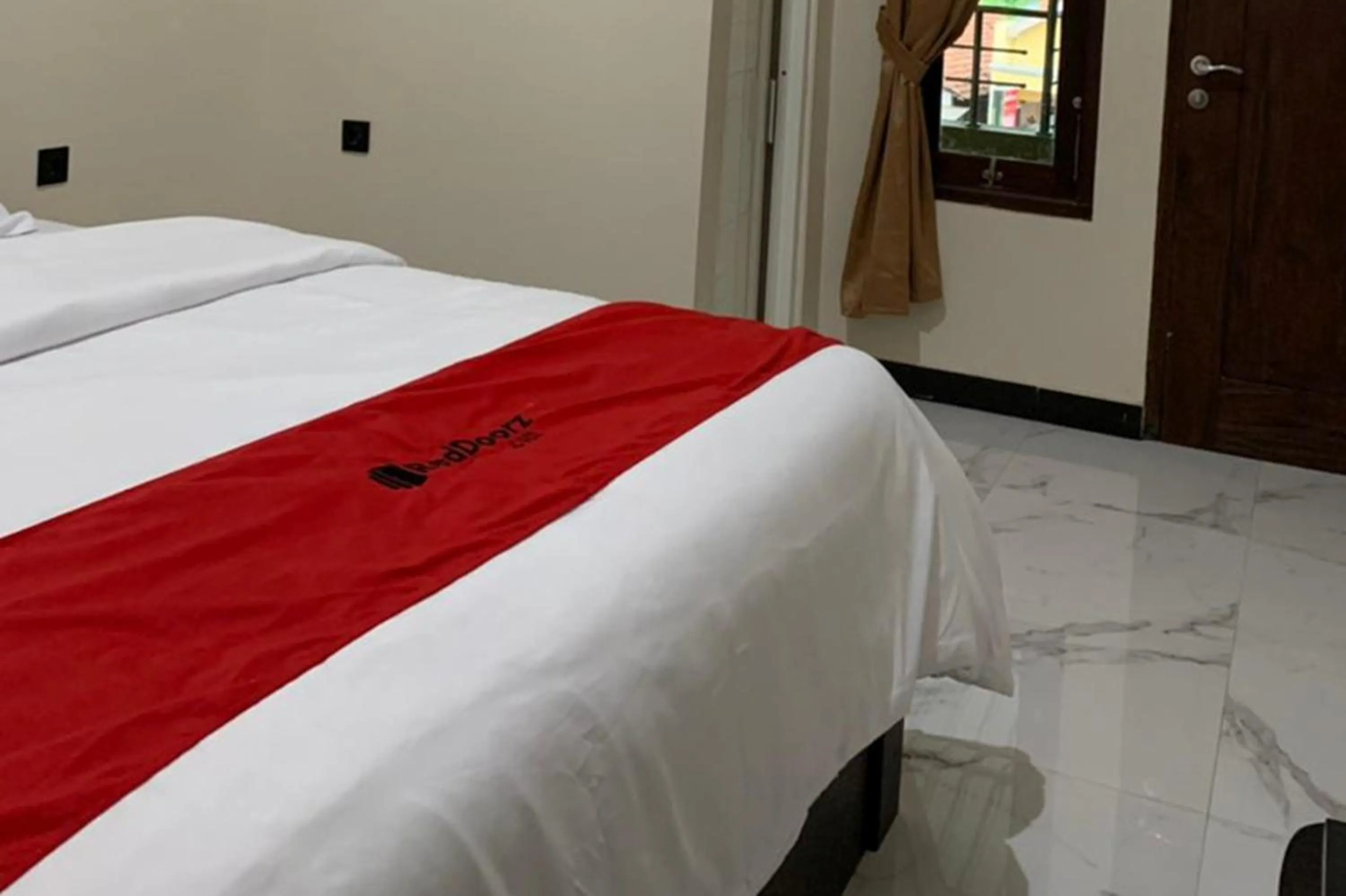 Bed in RedDoorz Syariah near Kawasan Simpang Lima Pati