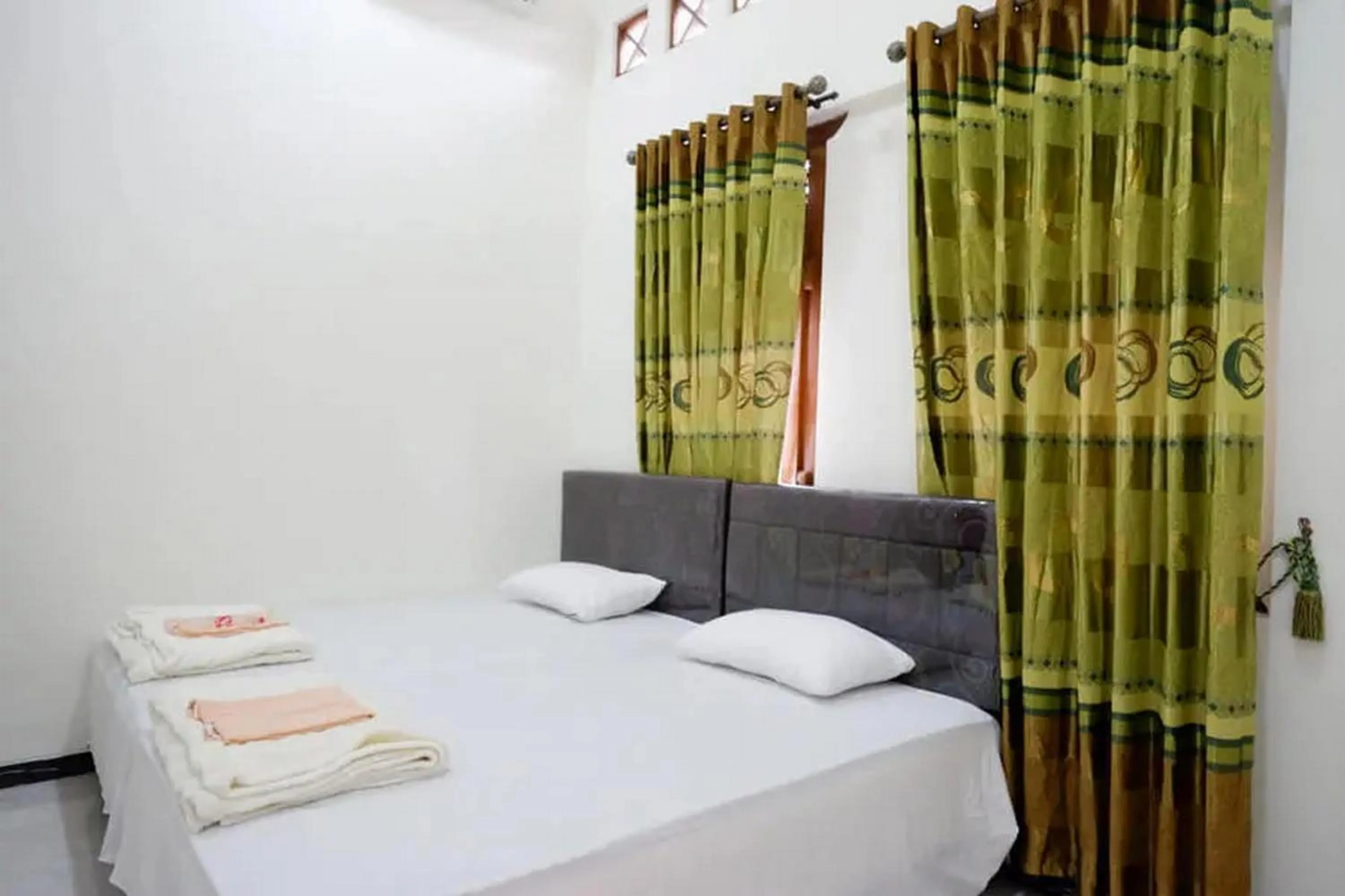 Bedroom, Bed in Griya Mataram Kotagede Mitra RedDoorz