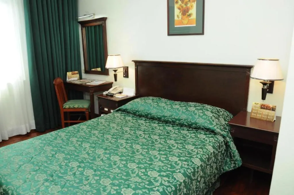 Bed in CityState Tower Hotel