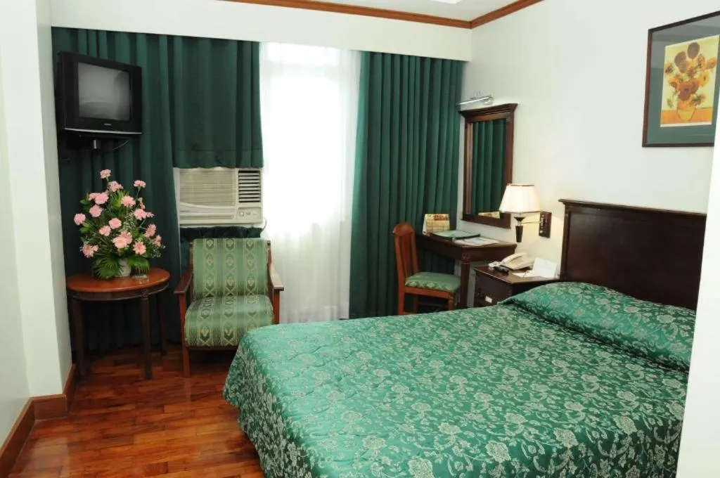 Bed in CityState Tower Hotel