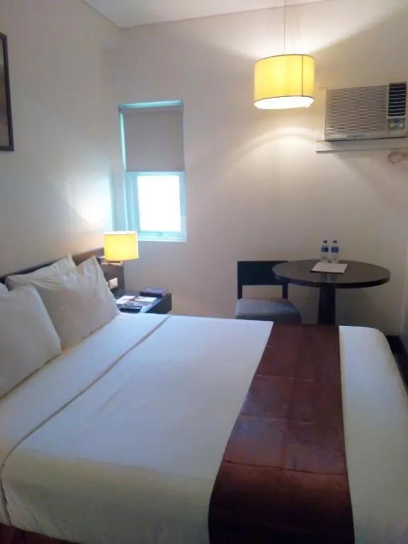 Bed in CityState Tower Hotel