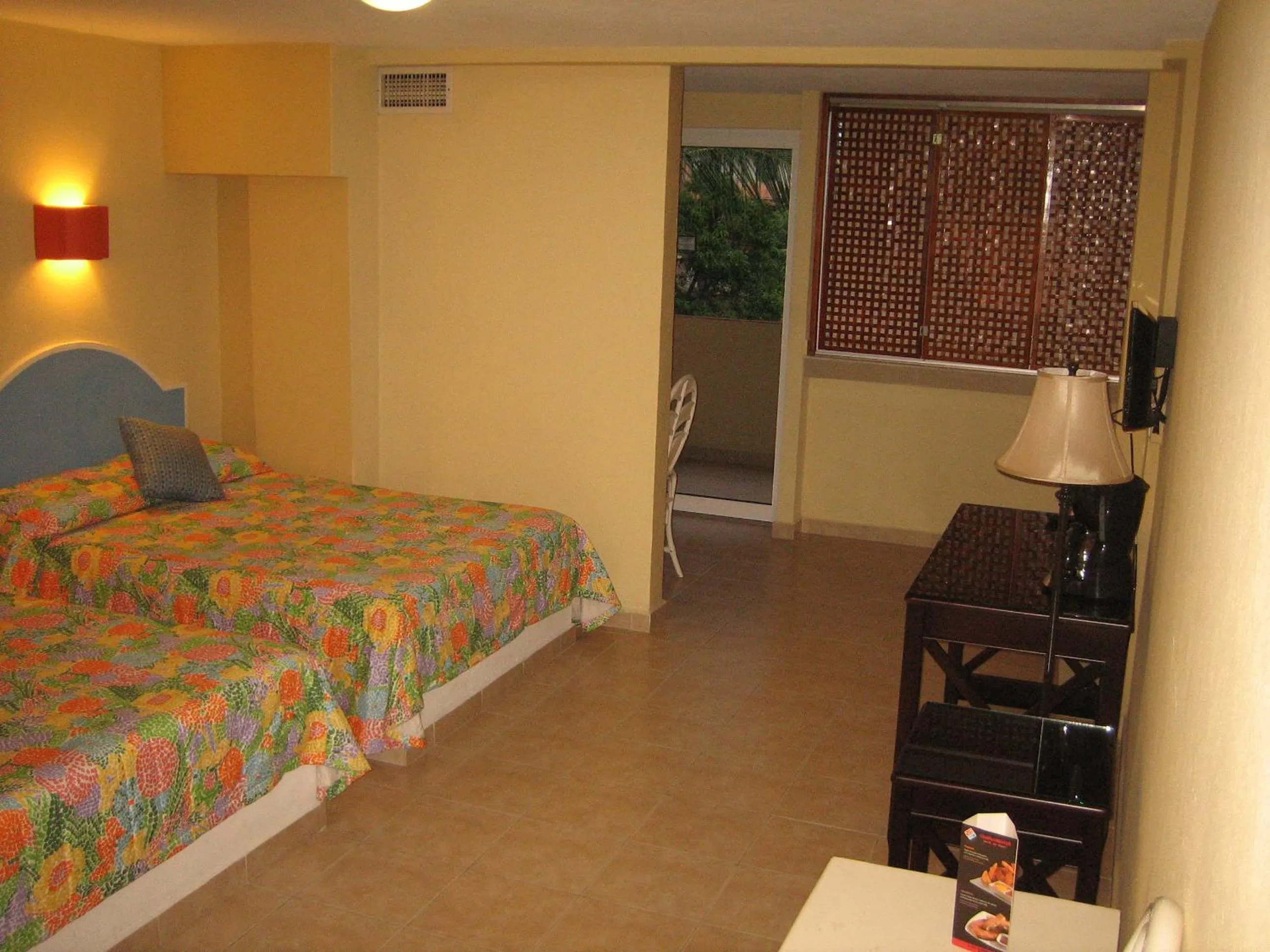 Bed in Hotel Delfines Acapulco by NG Hoteles