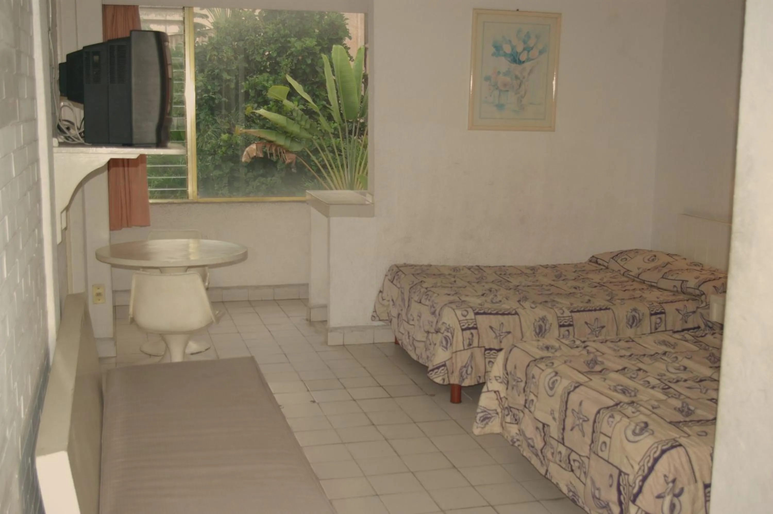 Bed in Hotel Delfines Acapulco by NG Hoteles