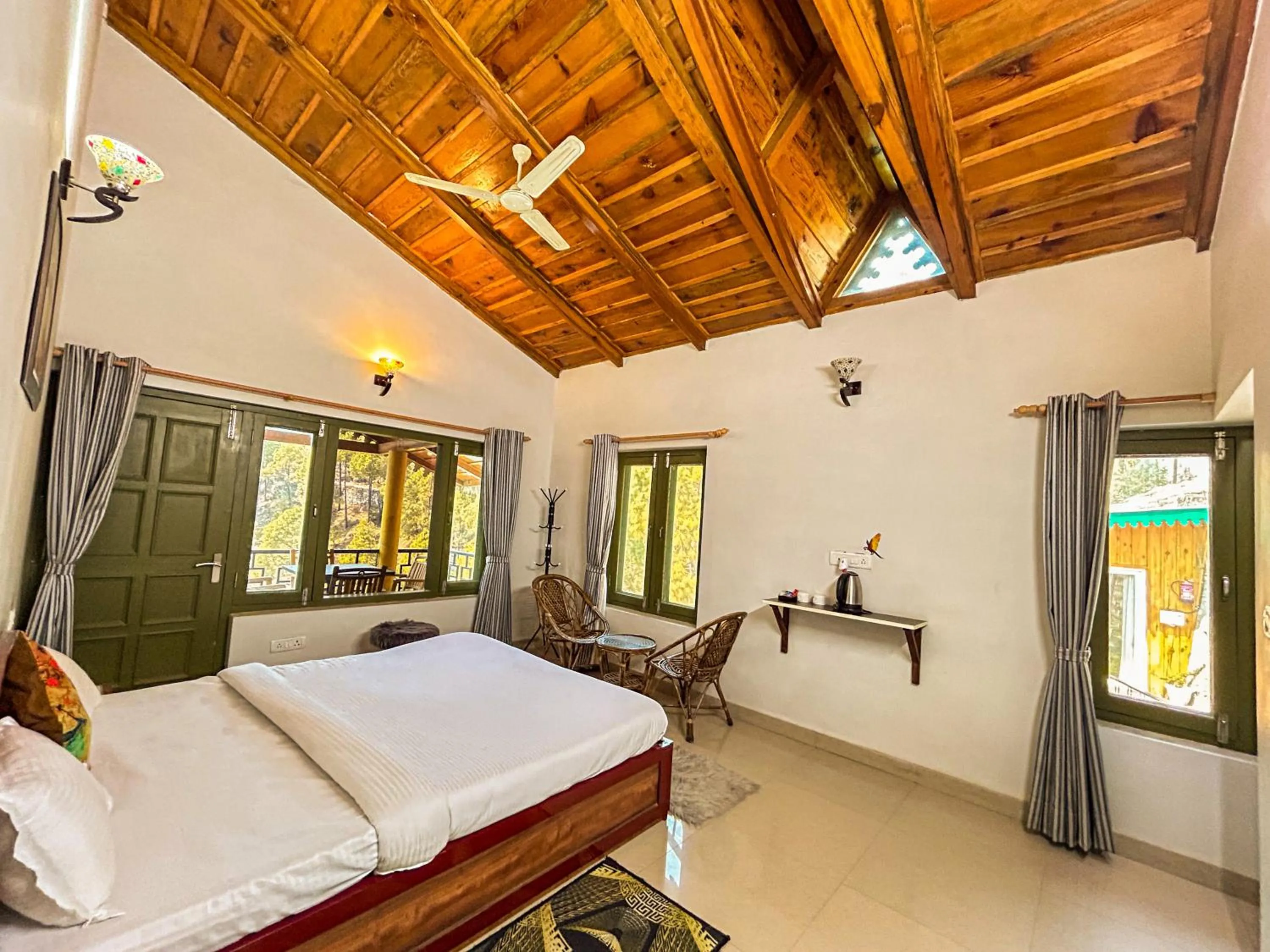 Photo of the whole room, Bed in THEHIMALAYANLIVING WHISTLING PINES