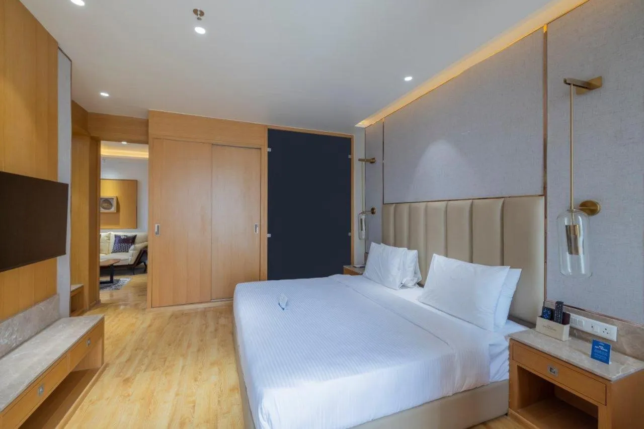 Bedroom in Sarovar Portico Morbi