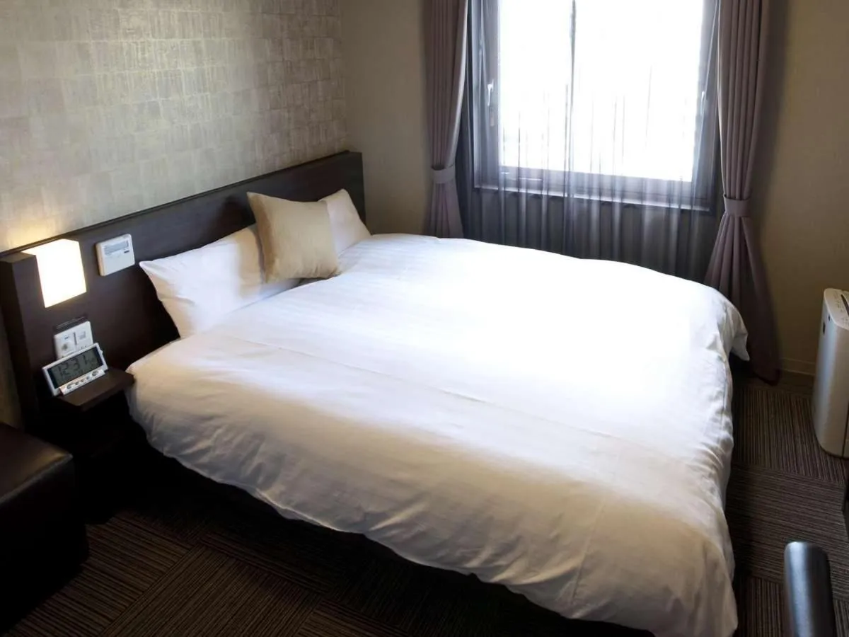Bed in Dormy Inn Premium Namba Natural Hot Spring