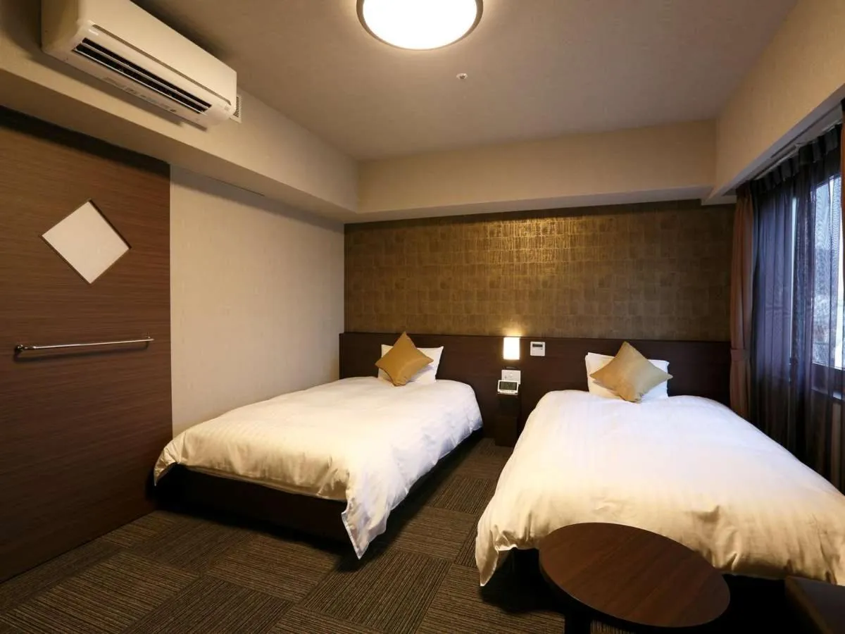 Bed in Dormy Inn Premium Namba Natural Hot Spring