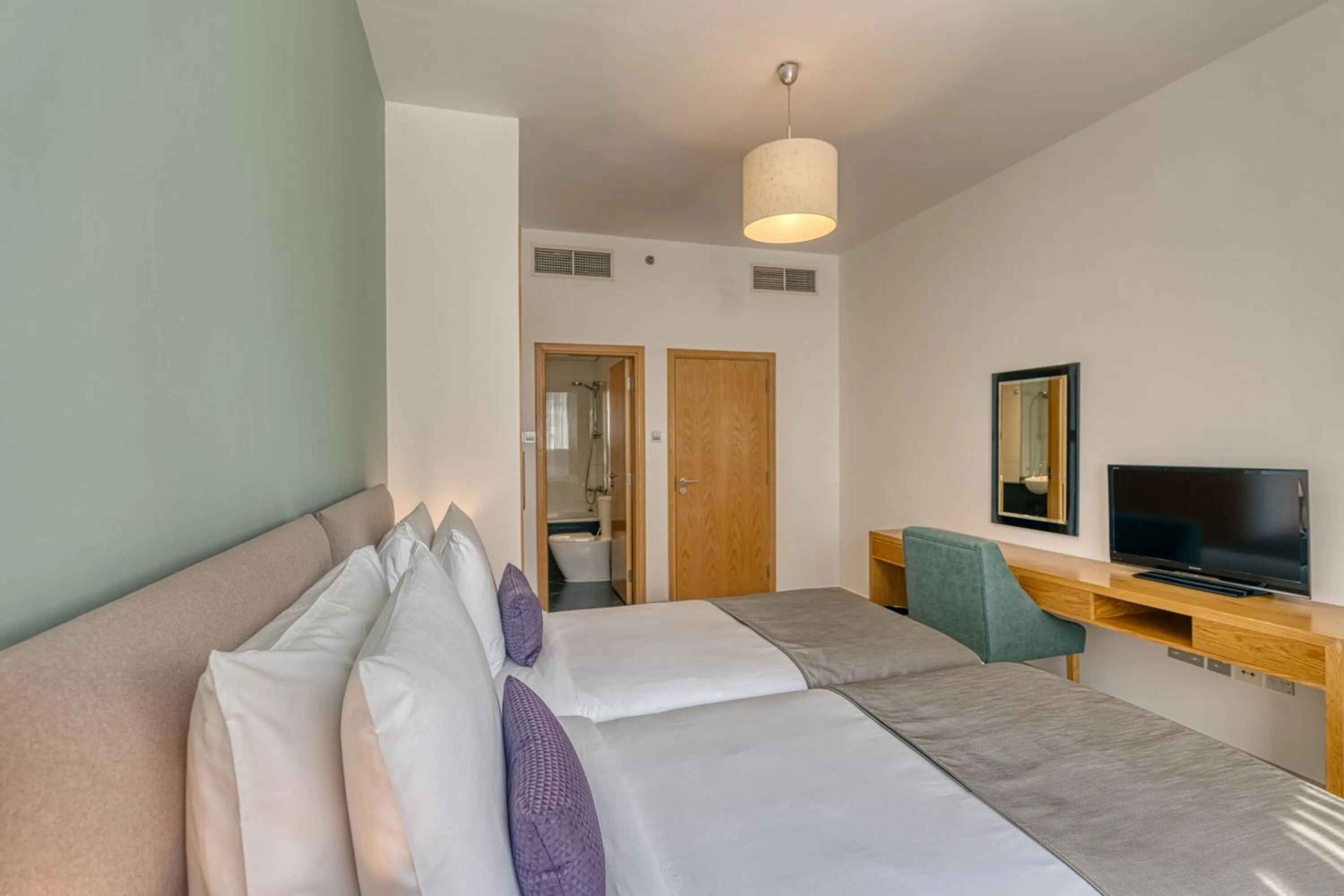 Bed in Grand Heights Dubai Hotel Apartments