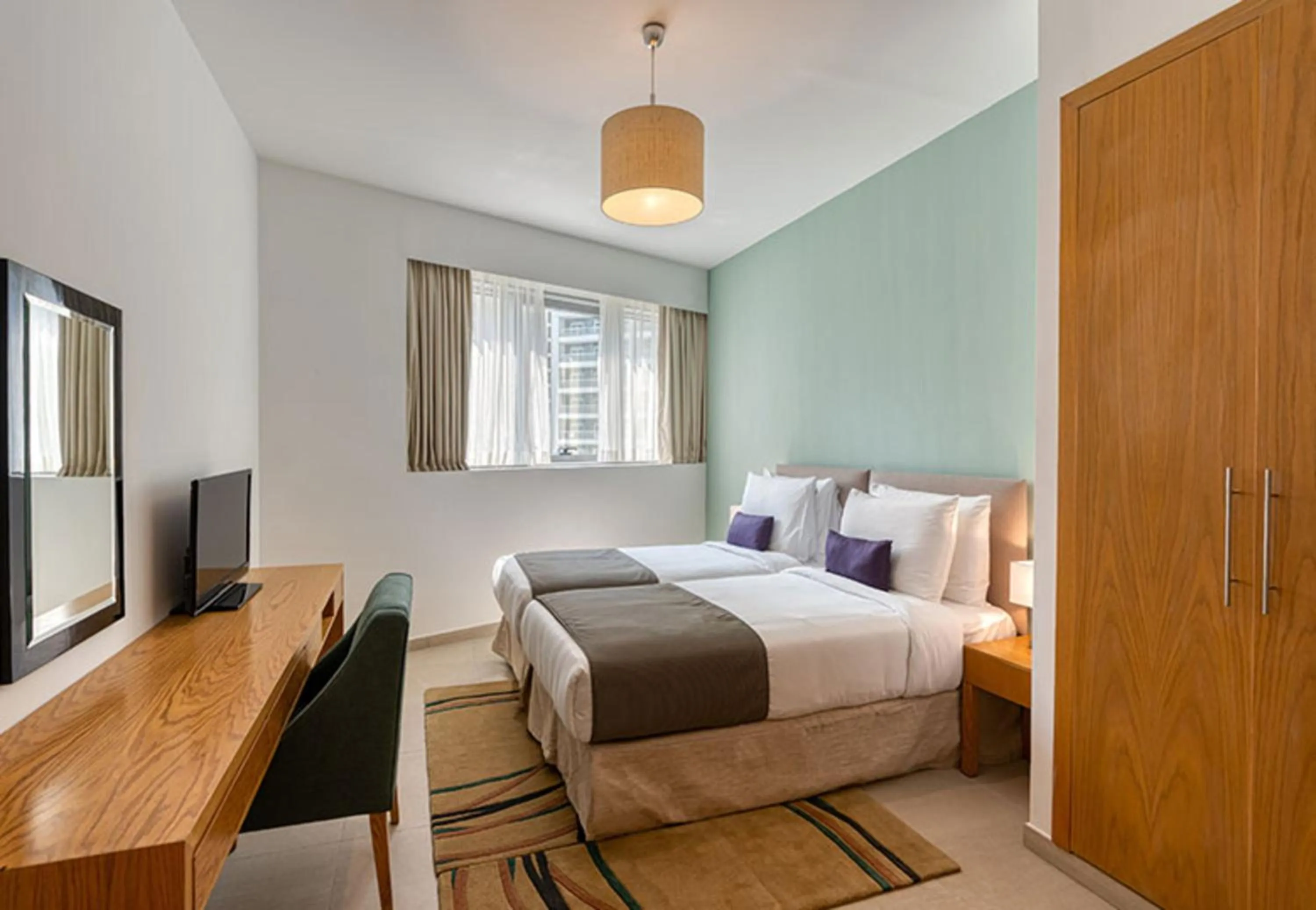 Bed in Grand Heights Dubai Hotel Apartments