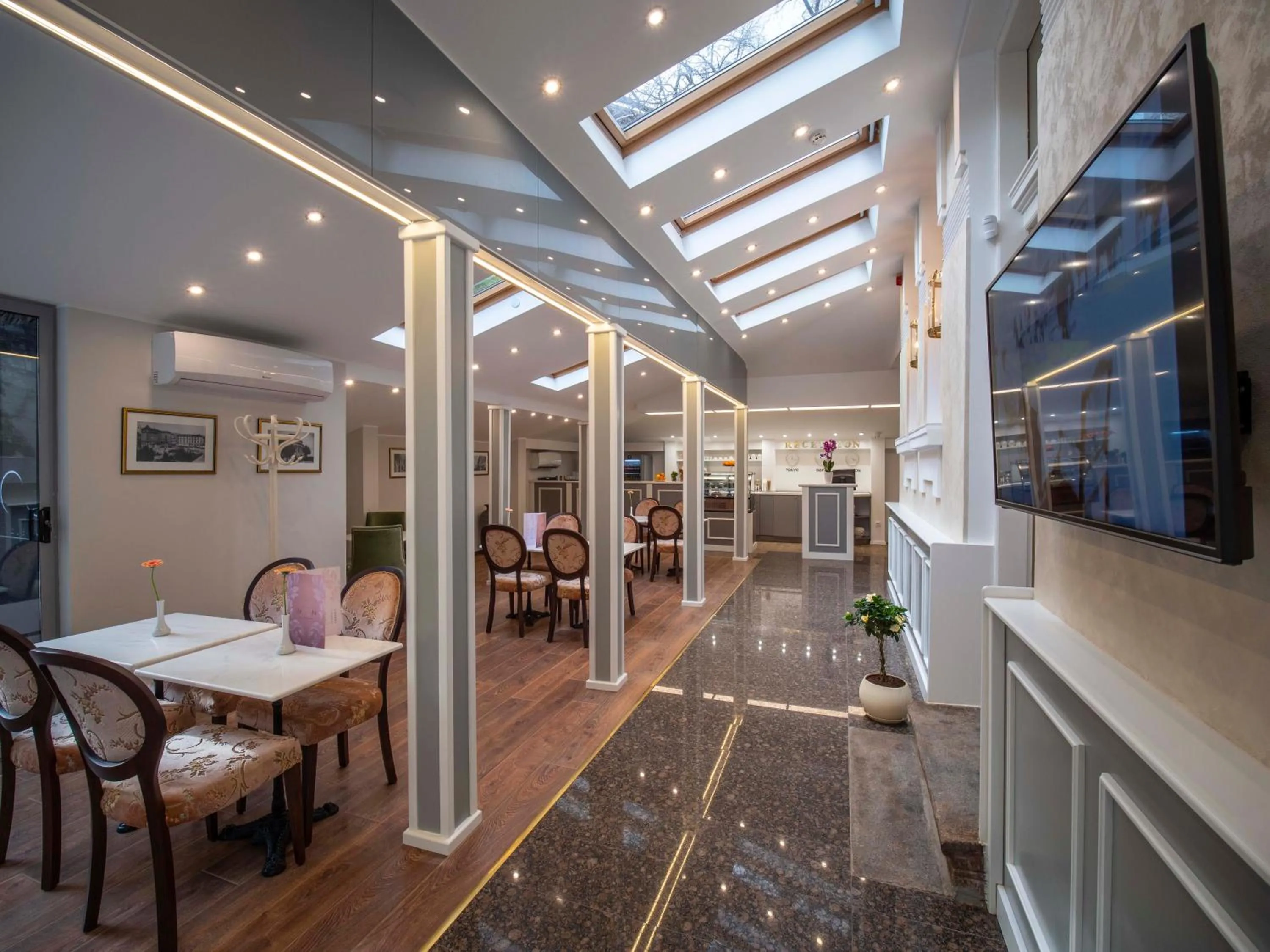 Communal lounge/ TV room in The Moon Boutique Hotel