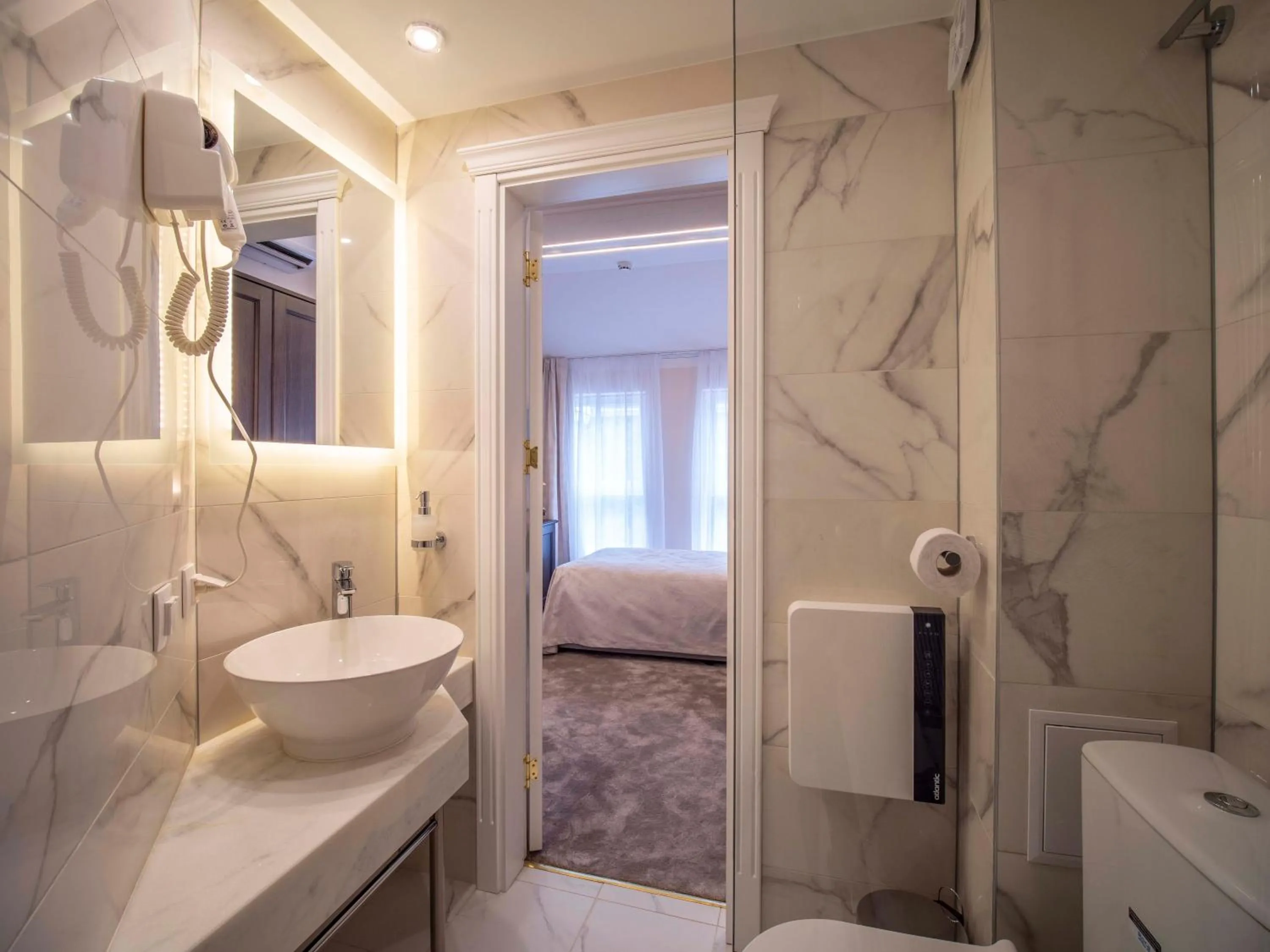 Toilet, Bed in The Moon Boutique Hotel