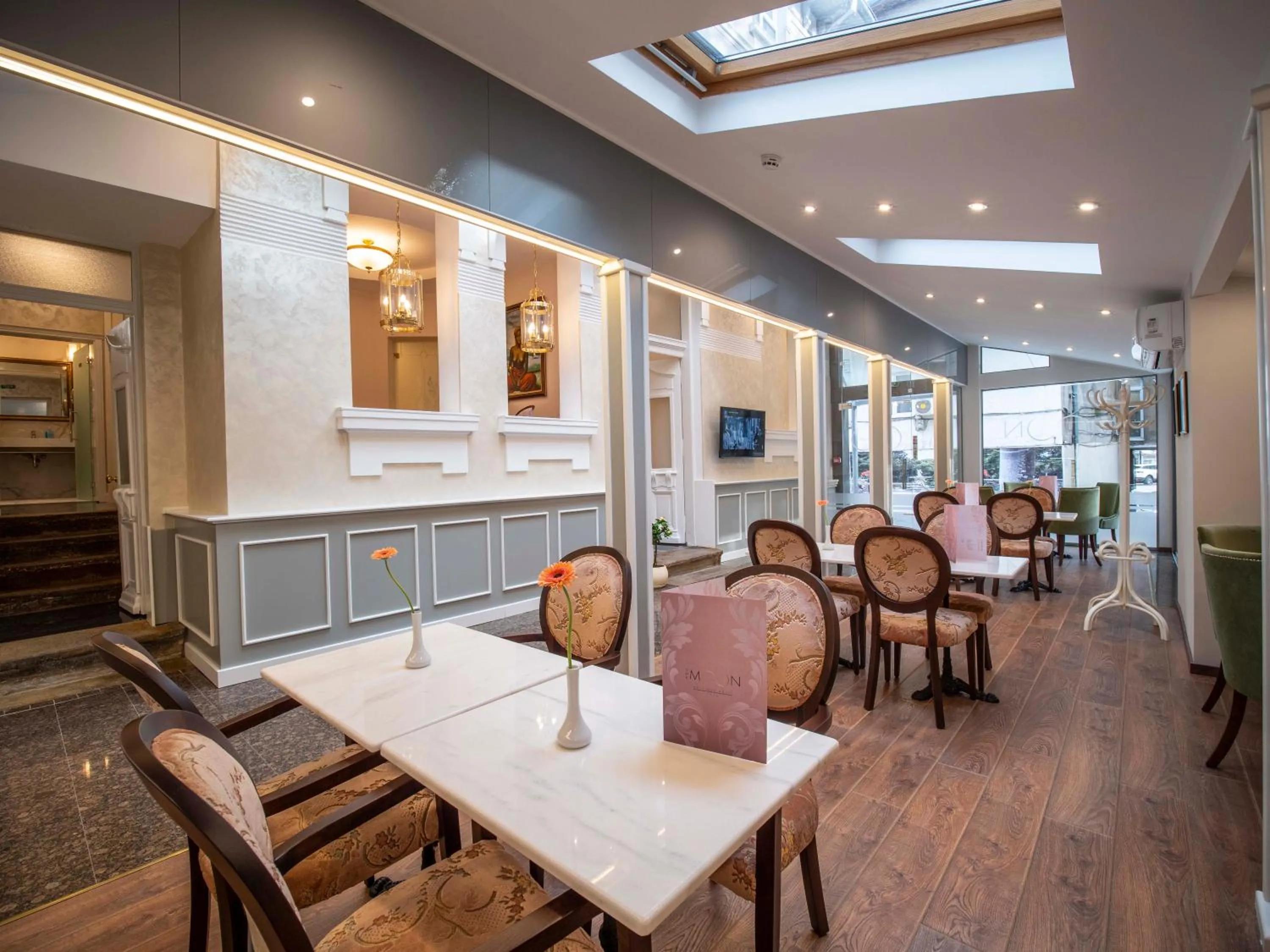 Communal lounge/ TV room in The Moon Boutique Hotel