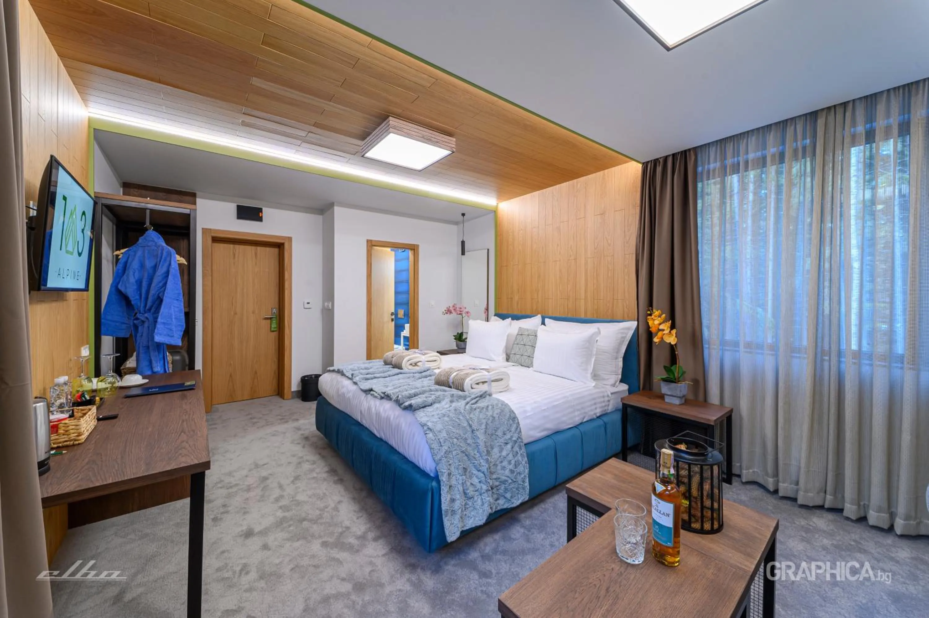 Bed in 103 Alpine Hotel