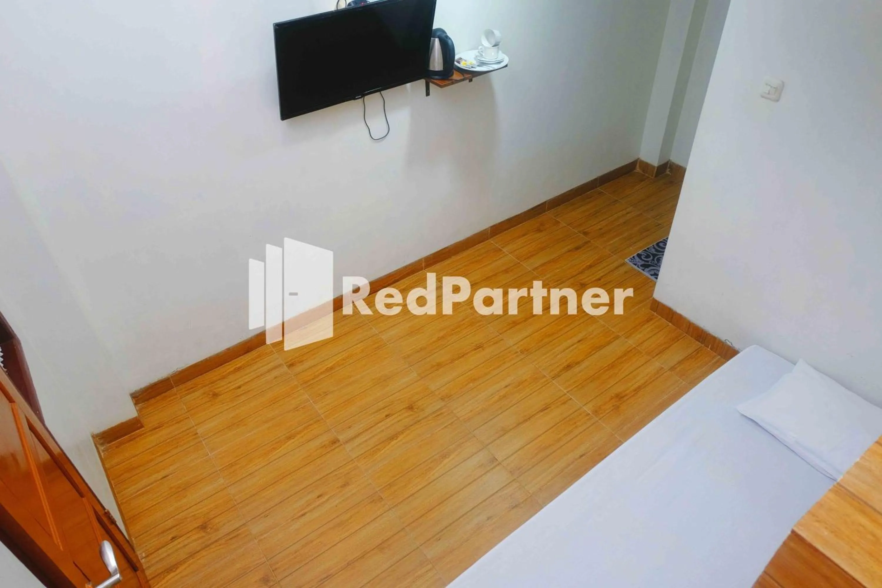 Bedroom in Guest House Bibong Makassar Mitra RedDoorz