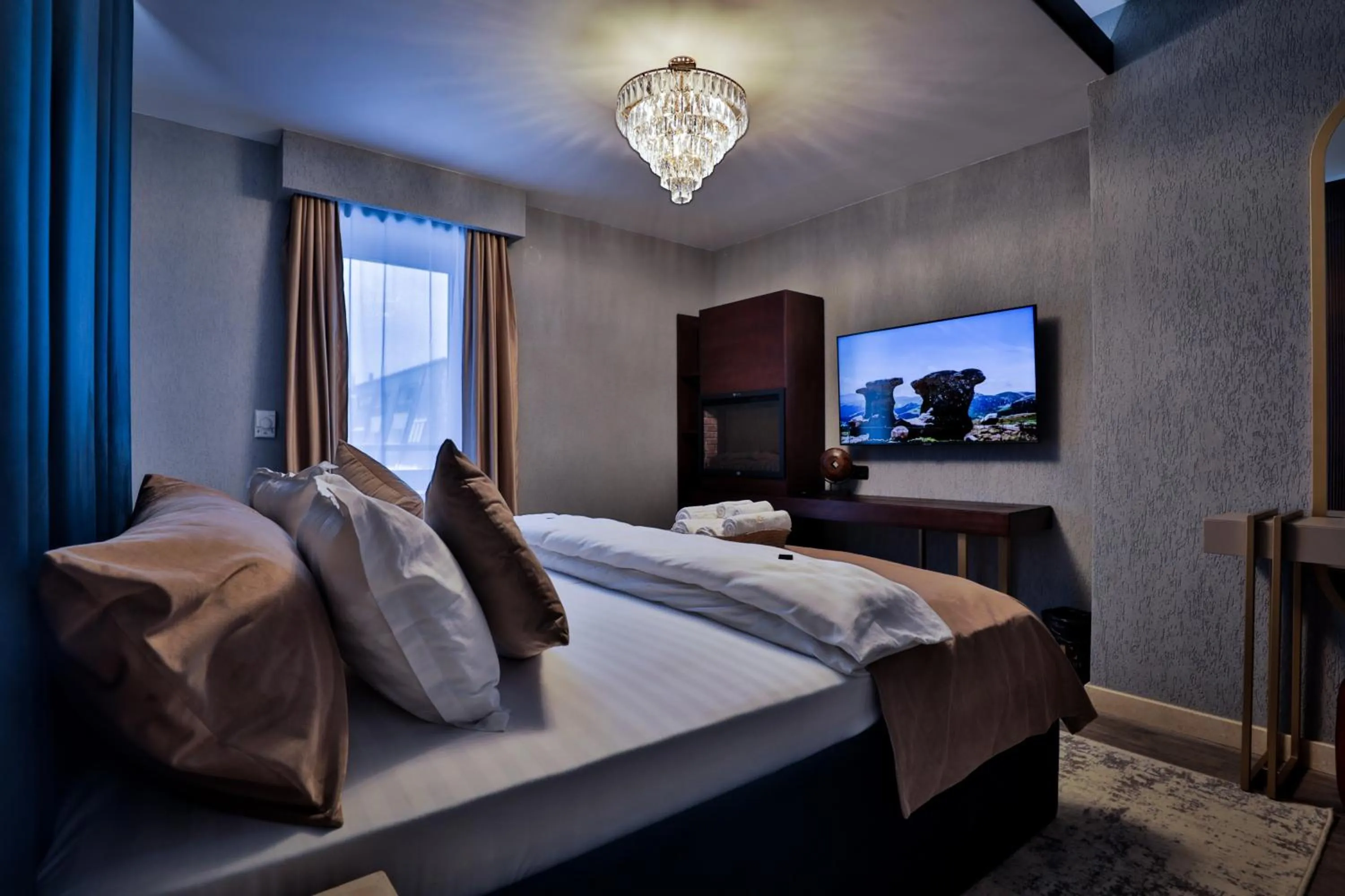 Bed in Elexus Apartments Poiana Brasov