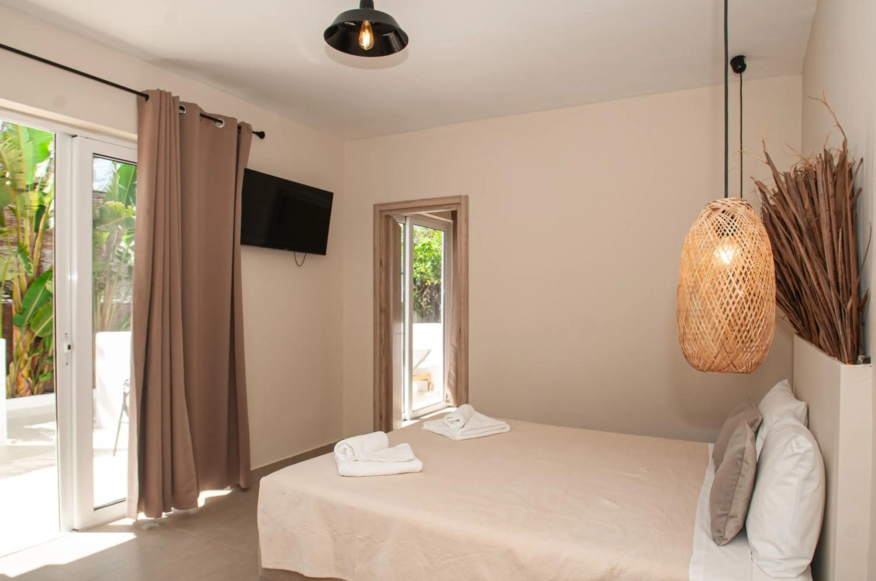 Bed in Atma Beach Rooms & Suites