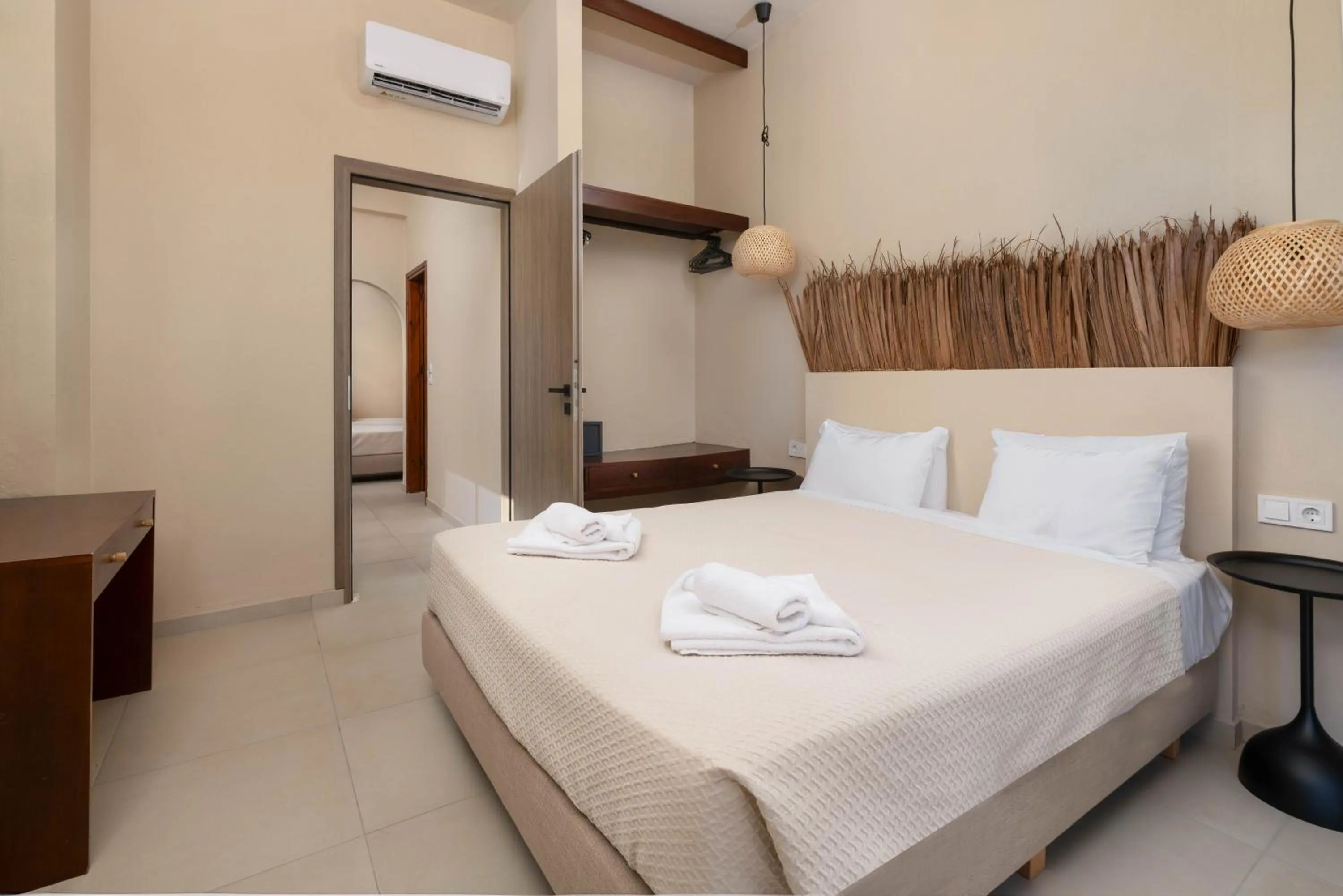 Bed in Atma Beach Rooms & Suites