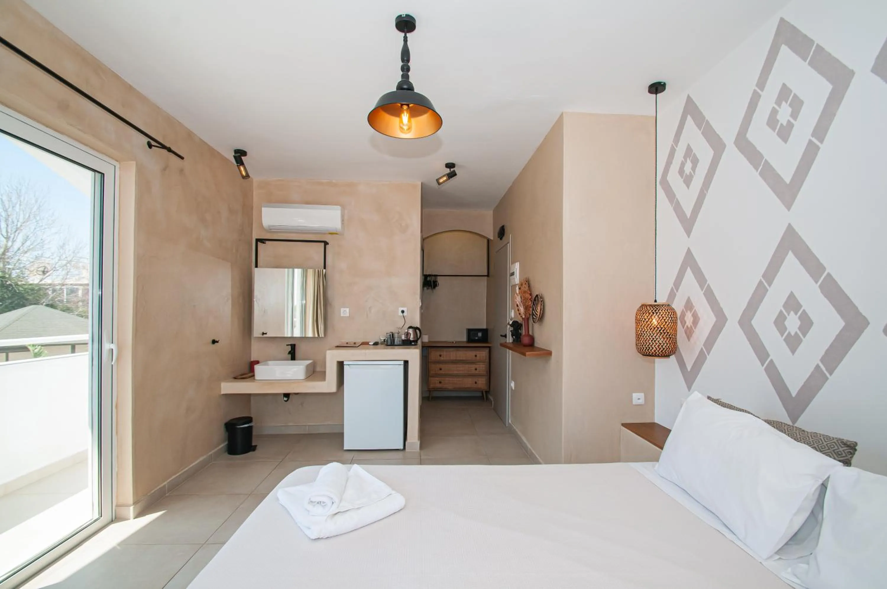 Bed in Atma Beach Rooms & Suites