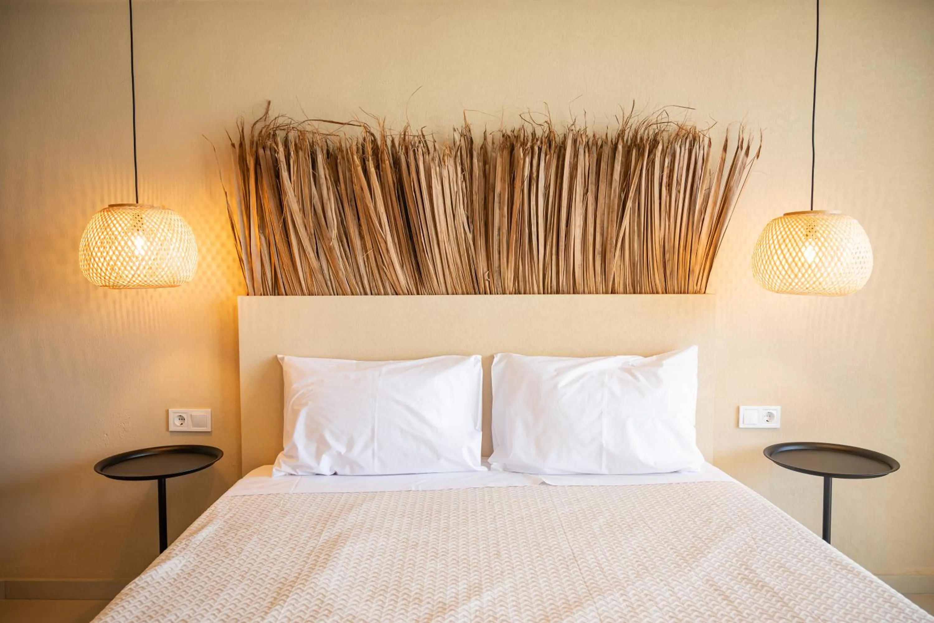 Bed in Atma Beach Rooms & Suites