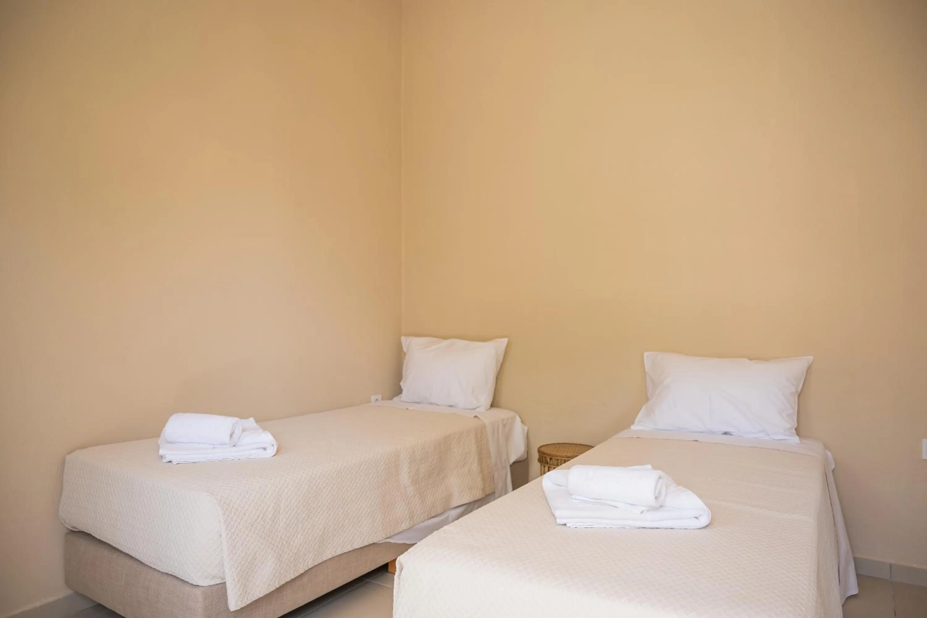 Bed in Atma Beach Rooms & Suites