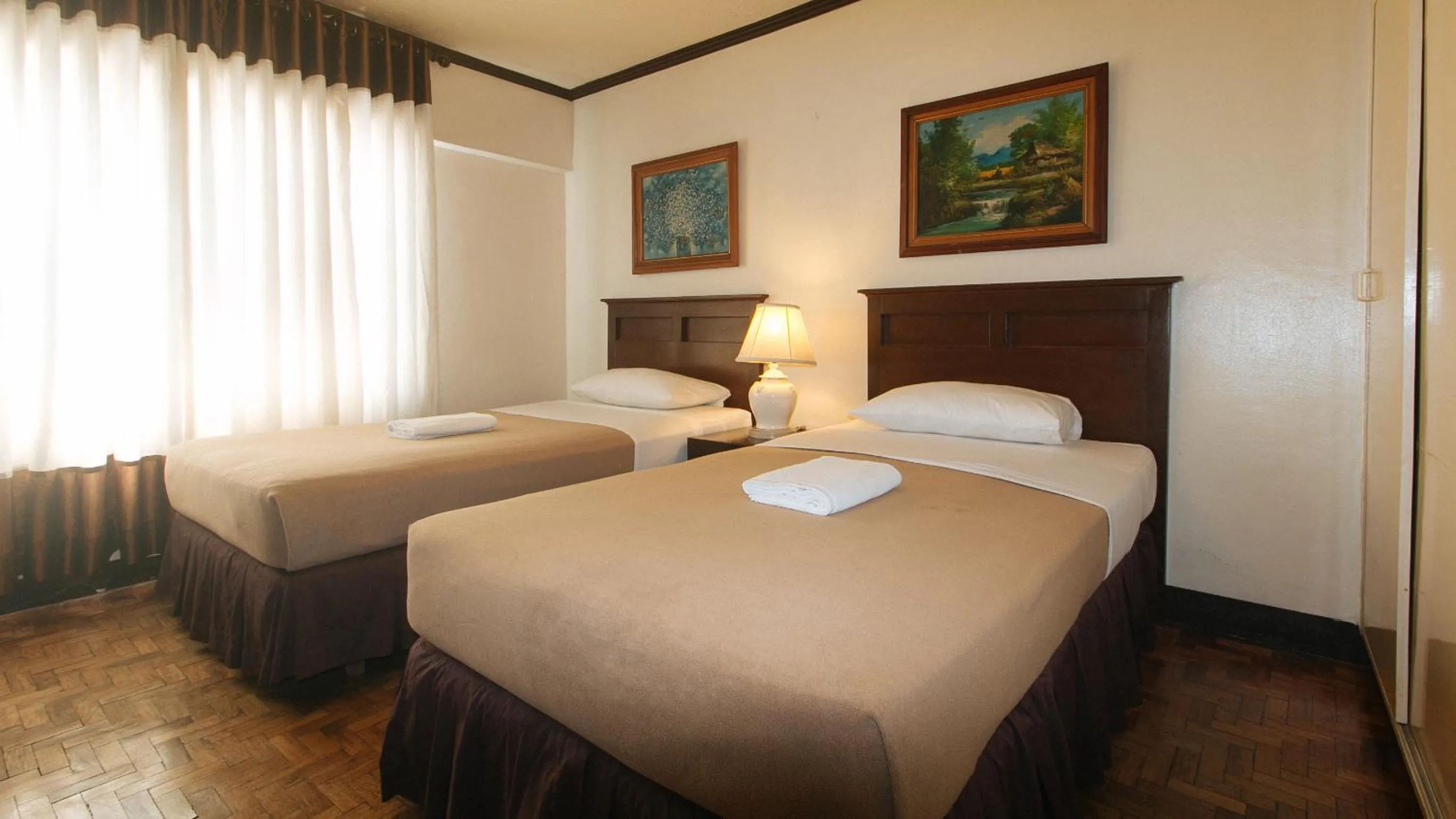 Bedroom, Bed in El Rico Suite Makati by RedDoorz