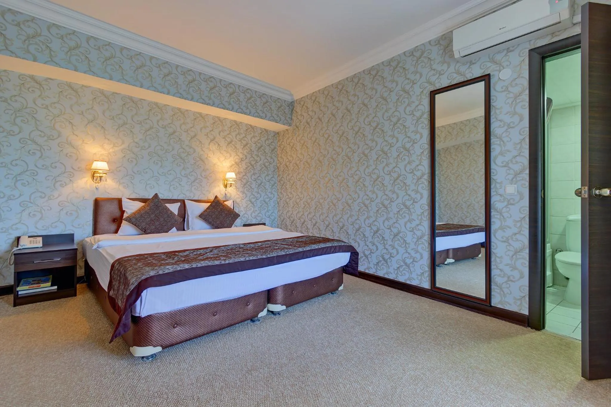 Bed in Premier Alatau Hotel