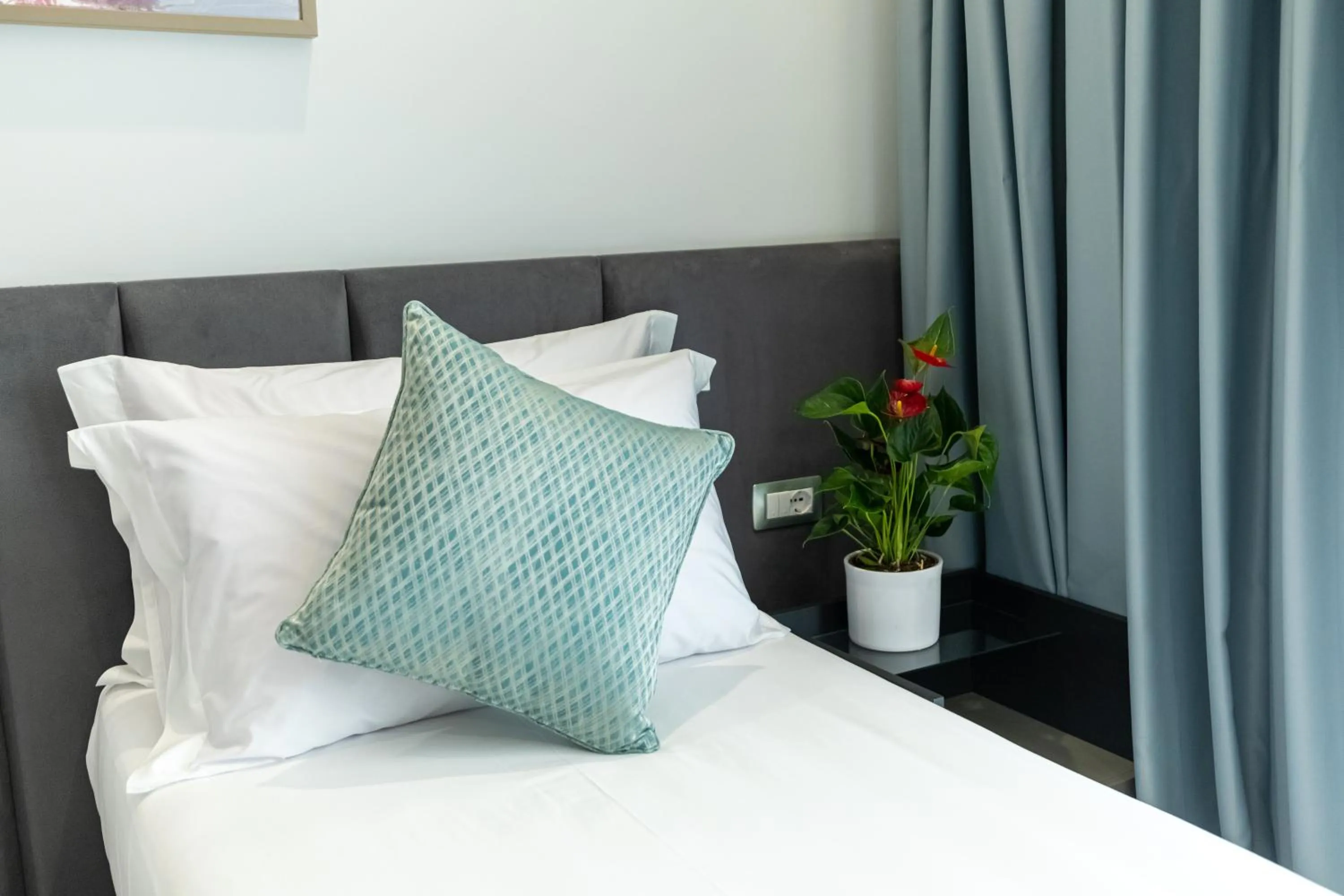 Bed in Ames Hotel & SPA