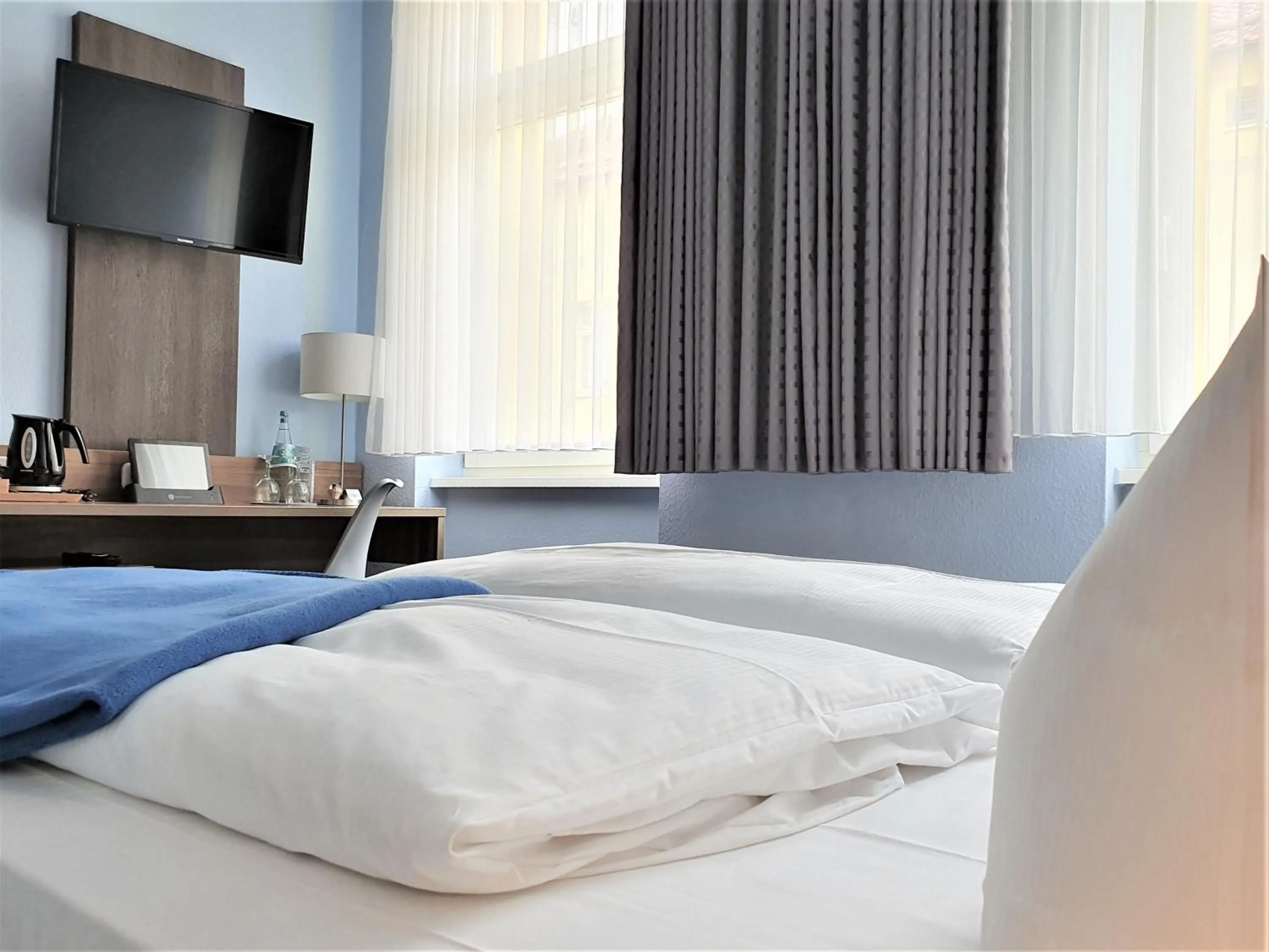 Bed in Melarose Feng Shui Hotel