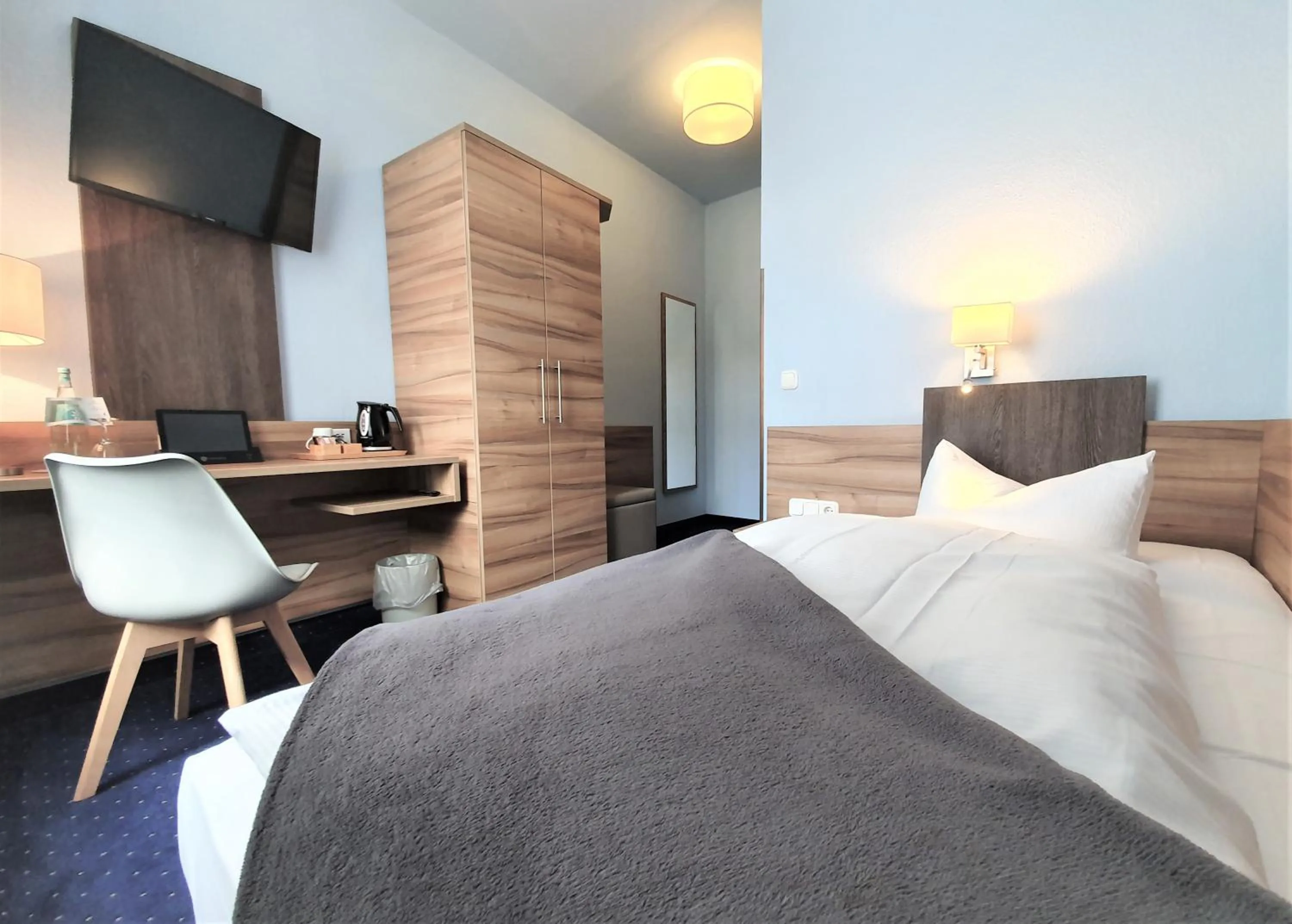 Bed in Melarose Feng Shui Hotel