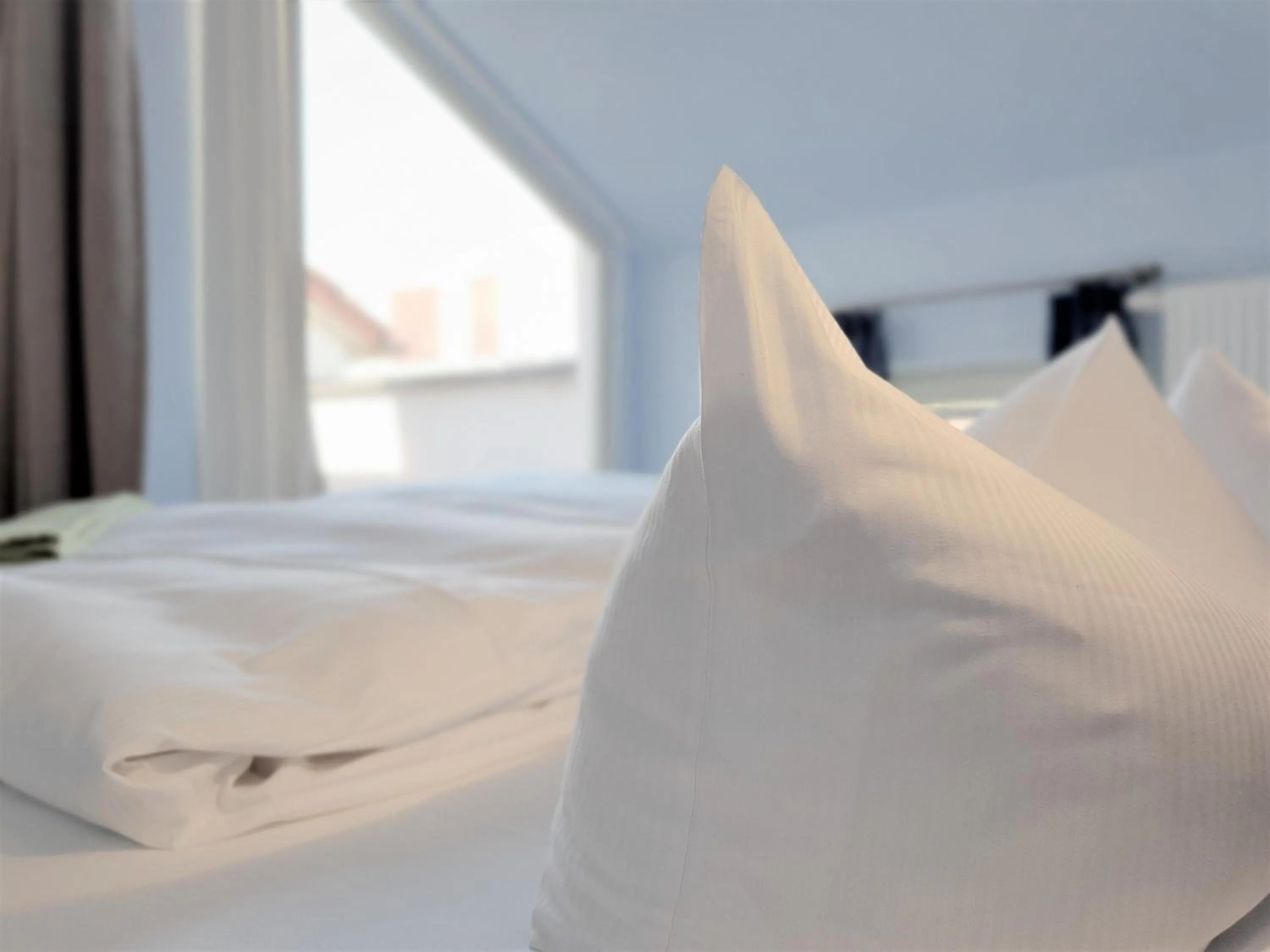 Bed in Melarose Feng Shui Hotel