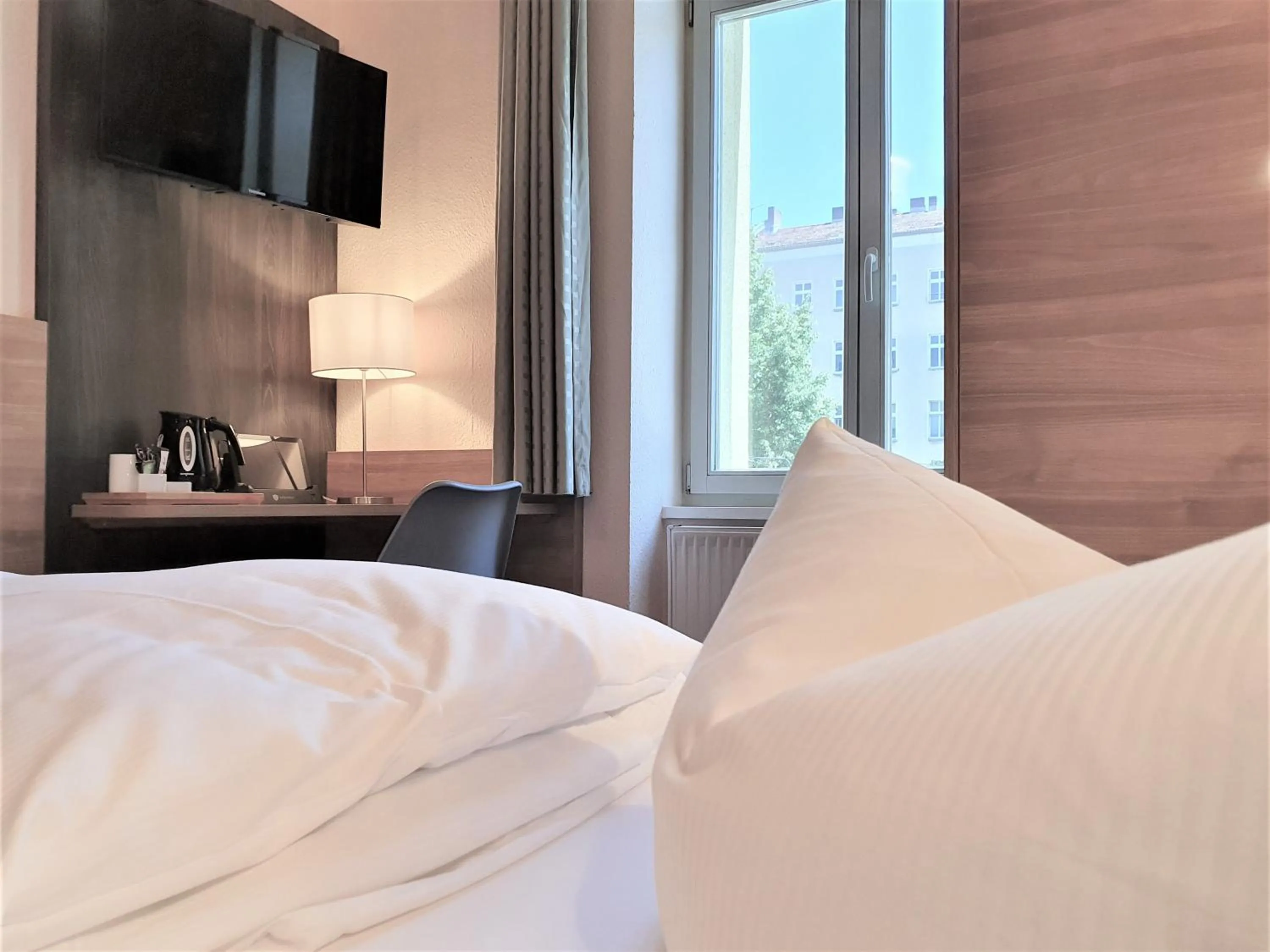 Bed in Melarose Feng Shui Hotel