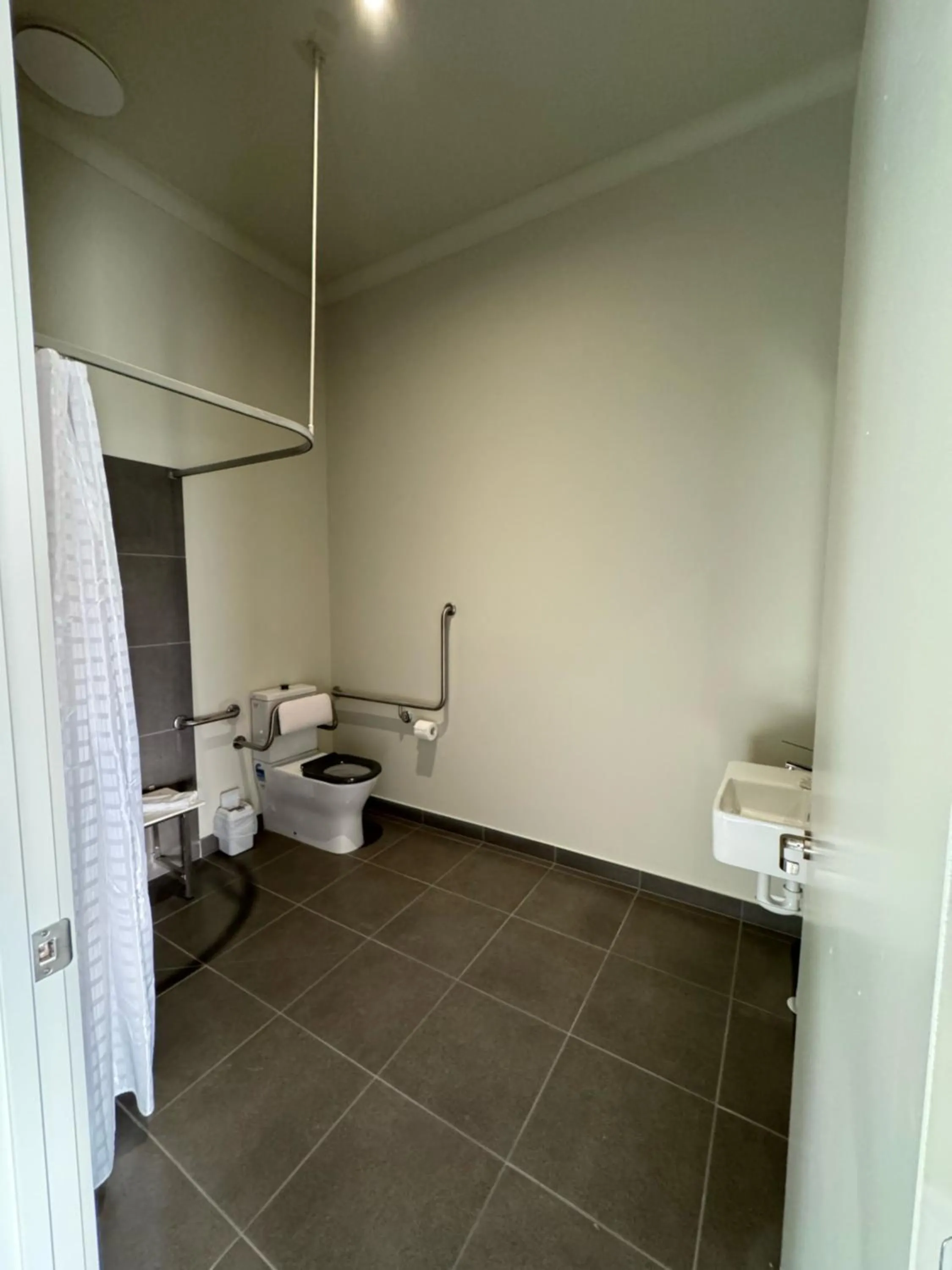 Shower in Falcon Hotel Motel