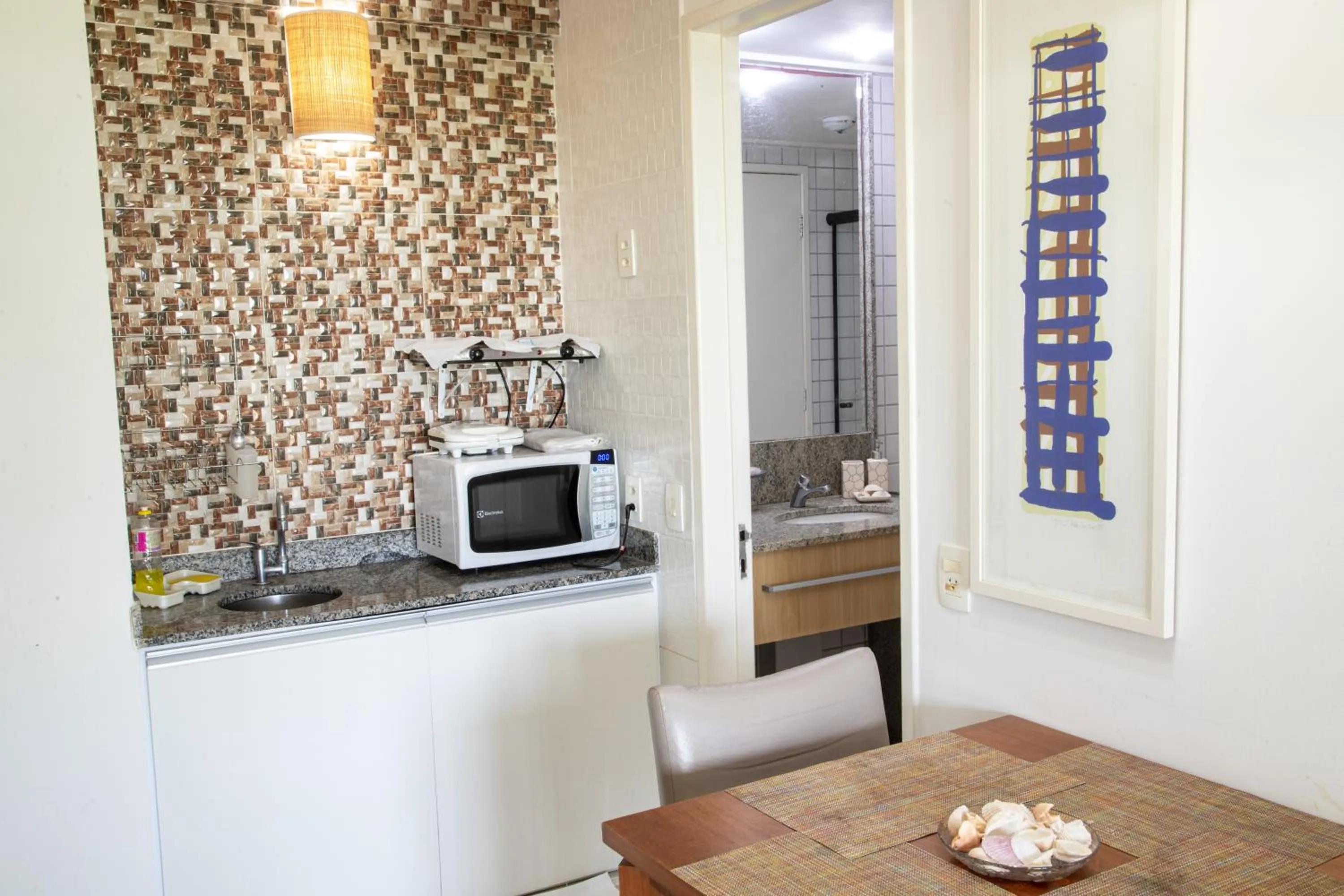 Kitchen or kitchenette in Beach Class Muro Alto Condomínio Resort By New Time