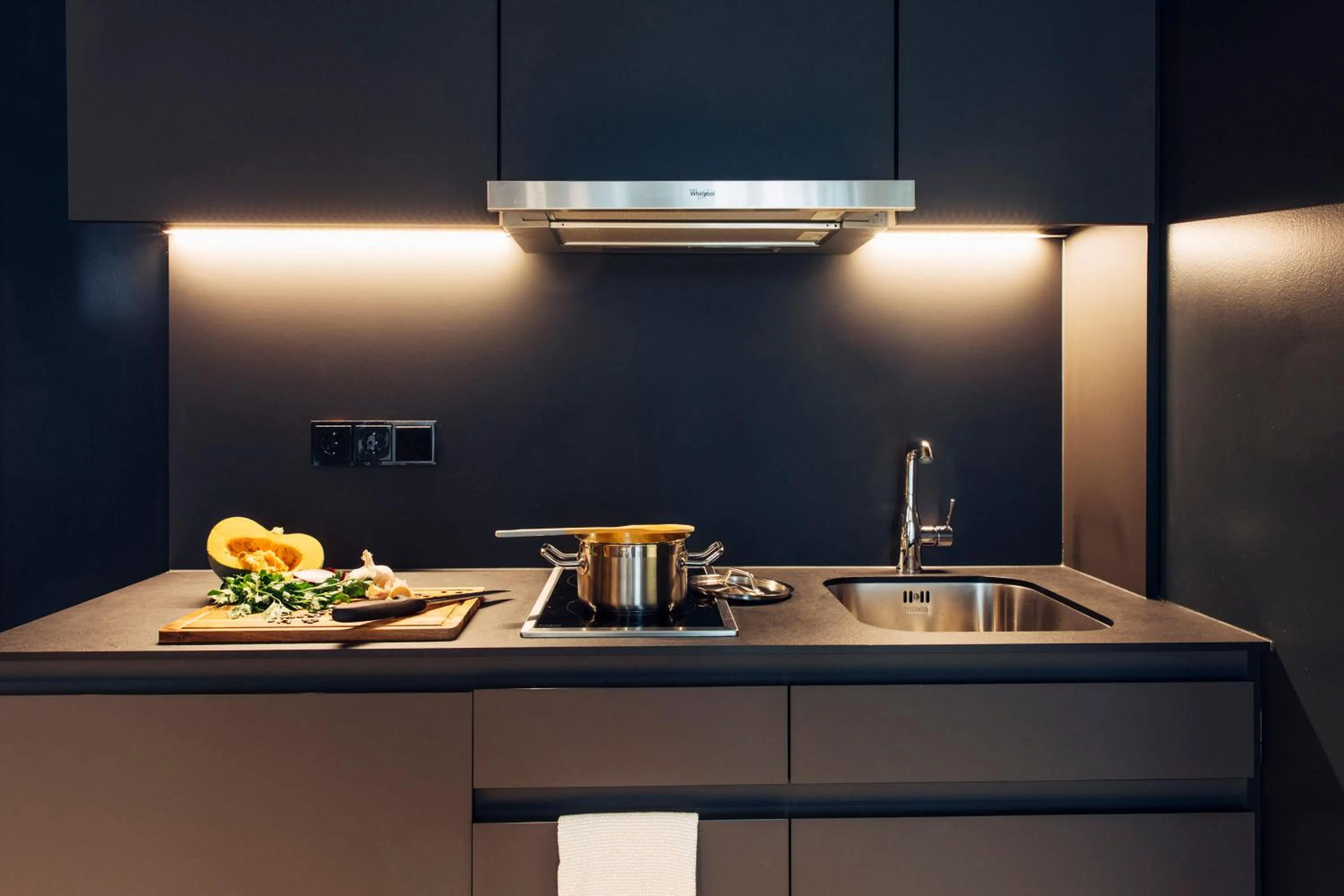 Kitchen or kitchenette in harry's home Bischofshofen hotel & apartments