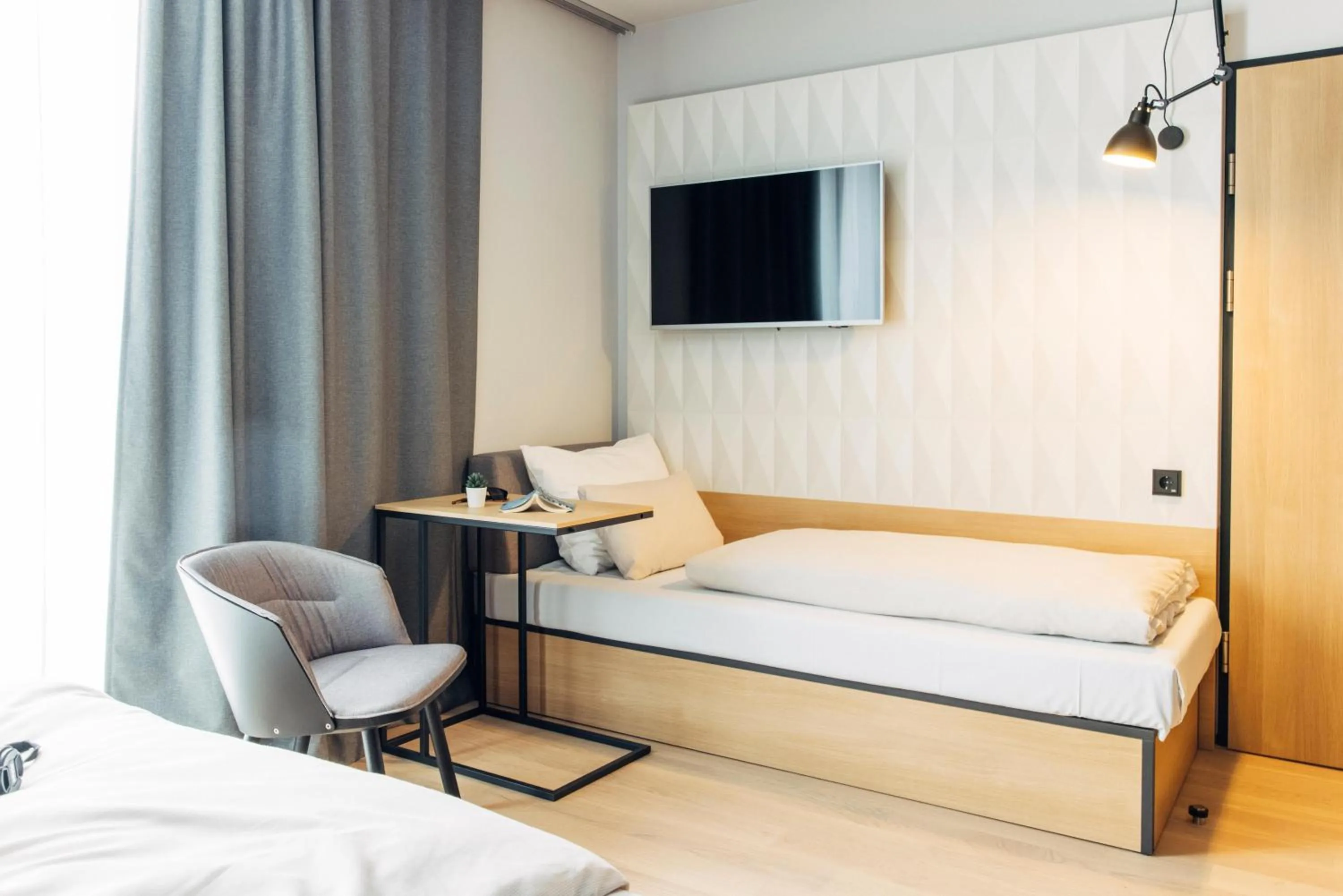 Photo of the whole room, Bed in harry's home Bischofshofen hotel & apartments