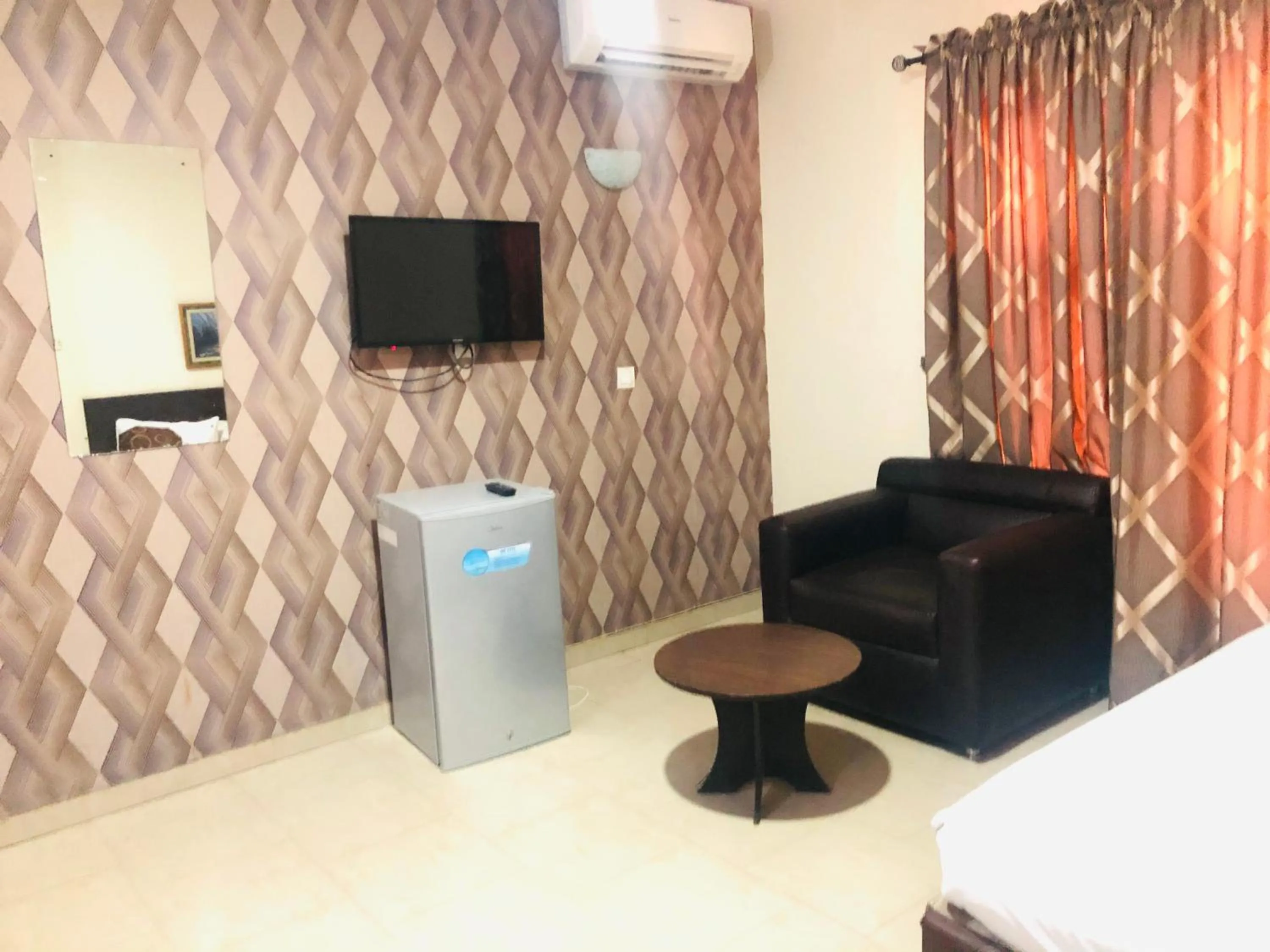 Seating area in Mayors & Diplomats Suites Opebi