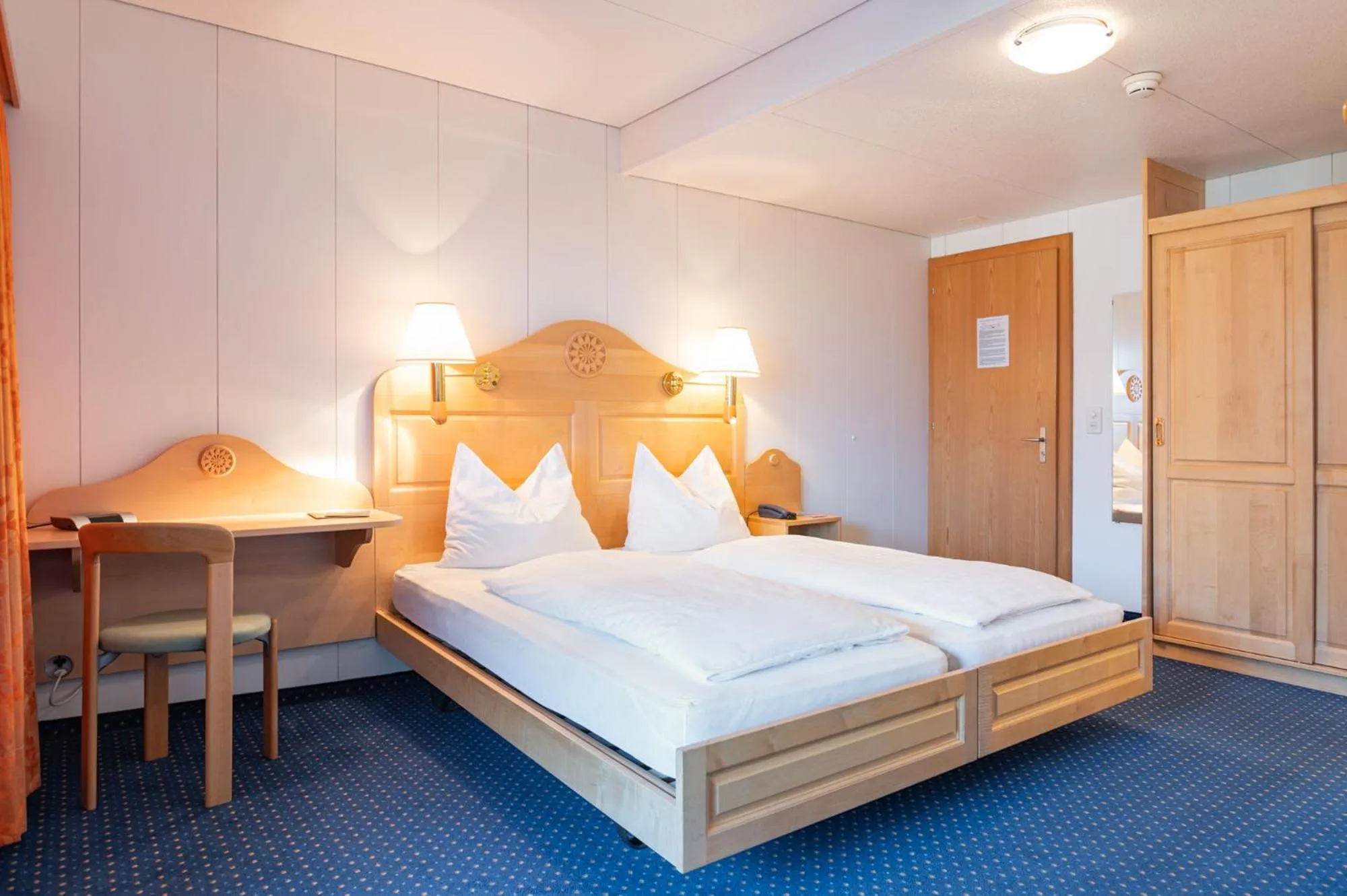 Bed in Hotel Bellevue - Traditional Swiss Hideaway