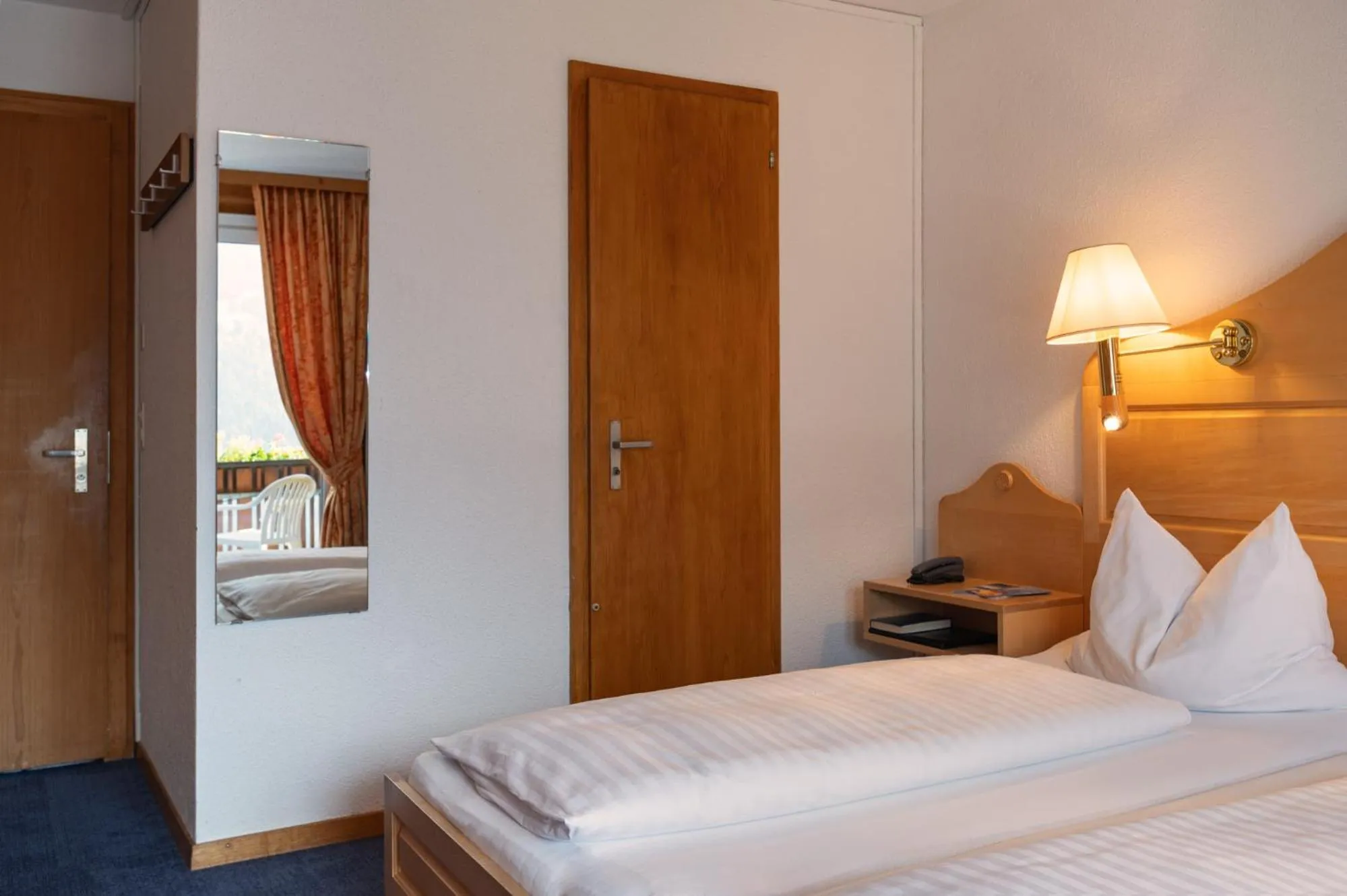 Bed in Hotel Bellevue - Traditional Swiss Hideaway