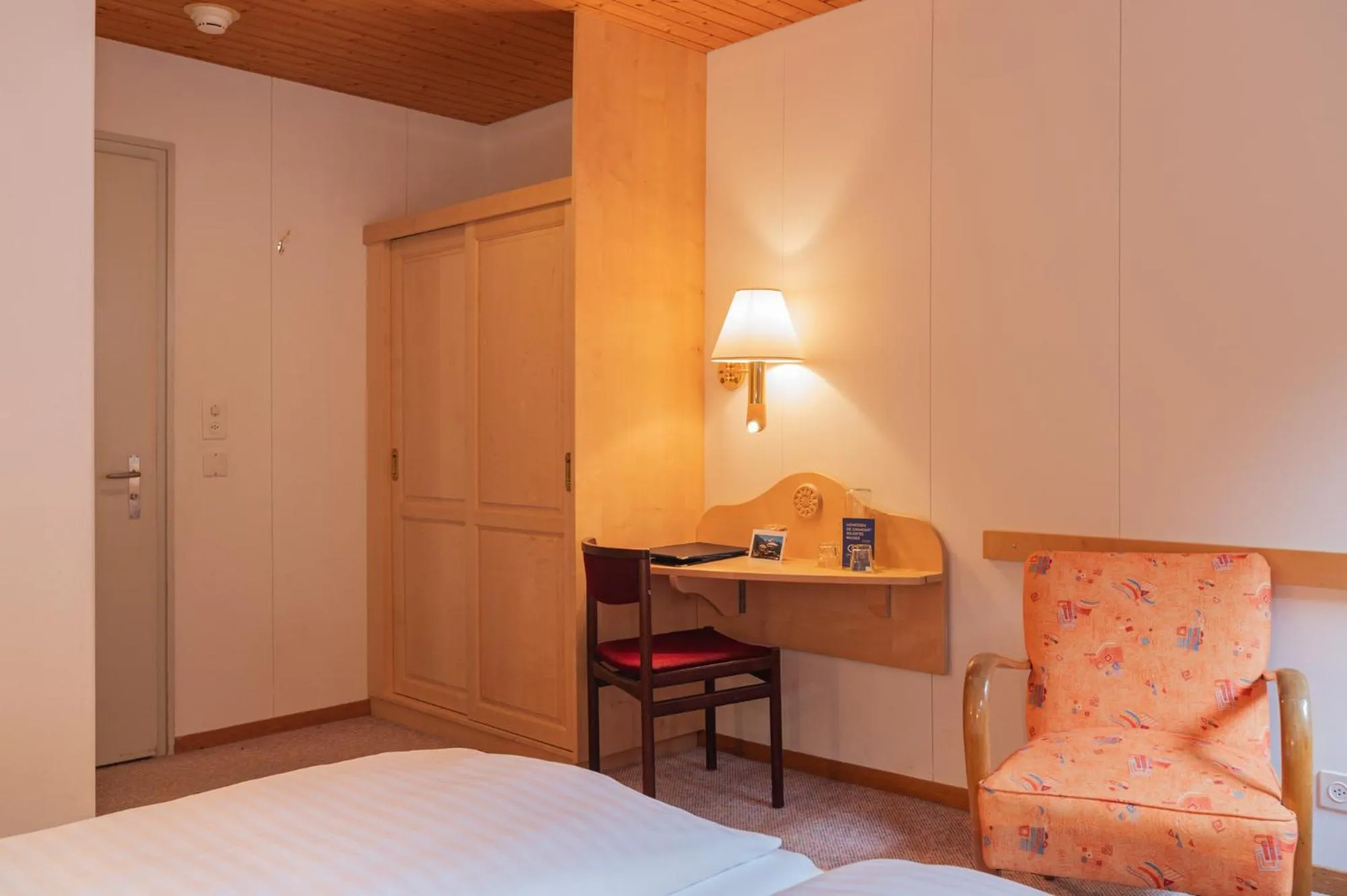 Bed in Hotel Bellevue - Traditional Swiss Hideaway