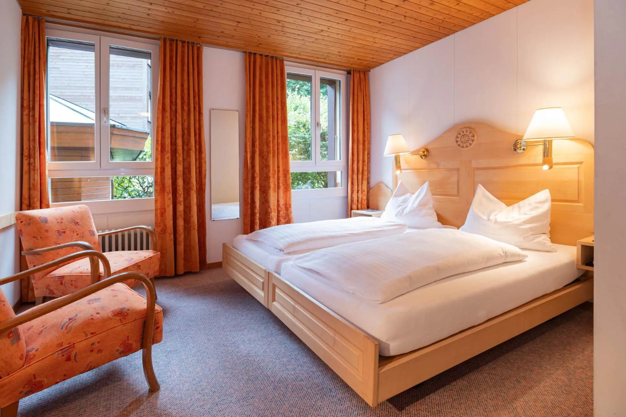 Bed in Hotel Bellevue - Traditional Swiss Hideaway