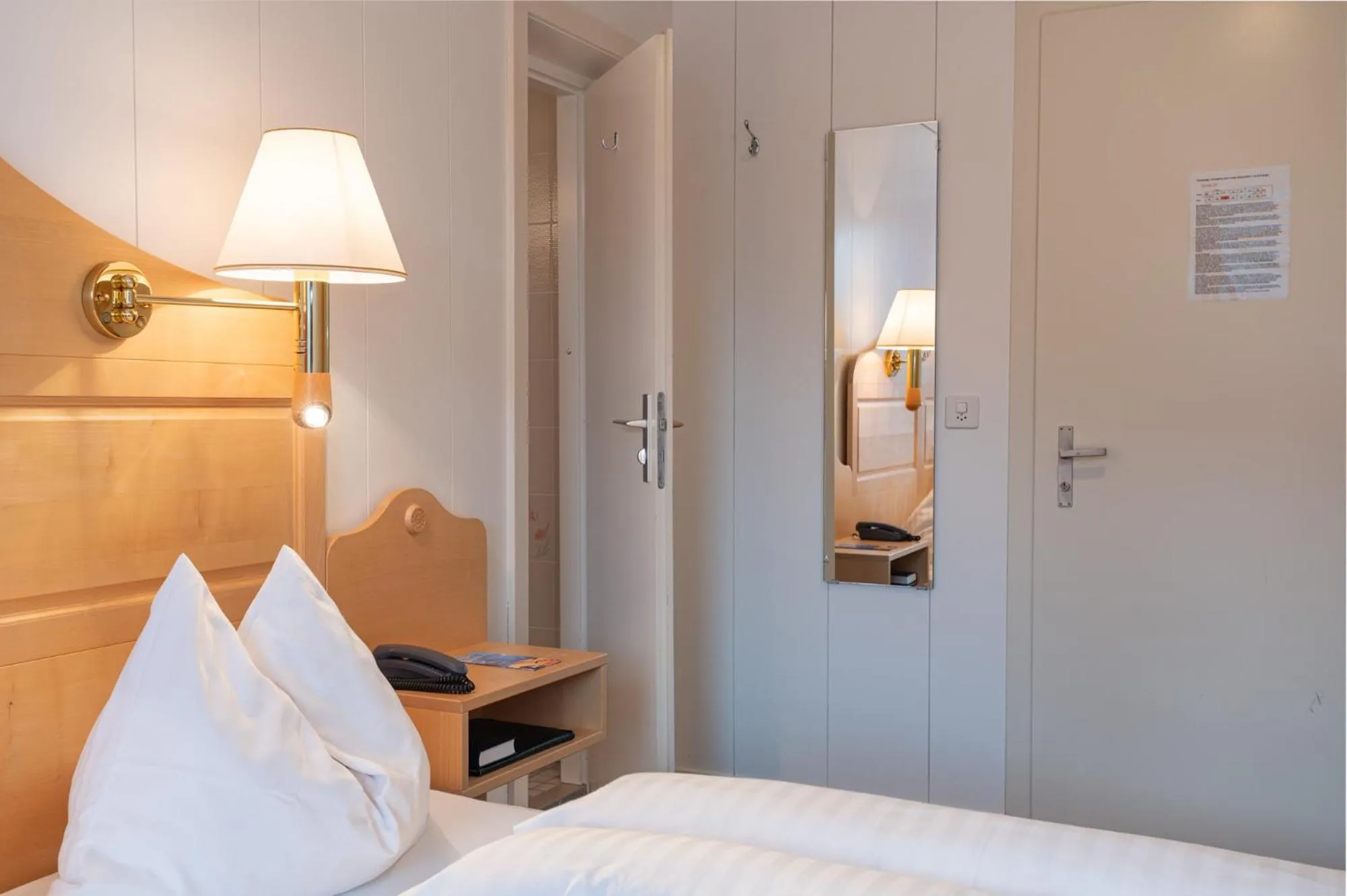 Bed in Hotel Bellevue - Traditional Swiss Hideaway