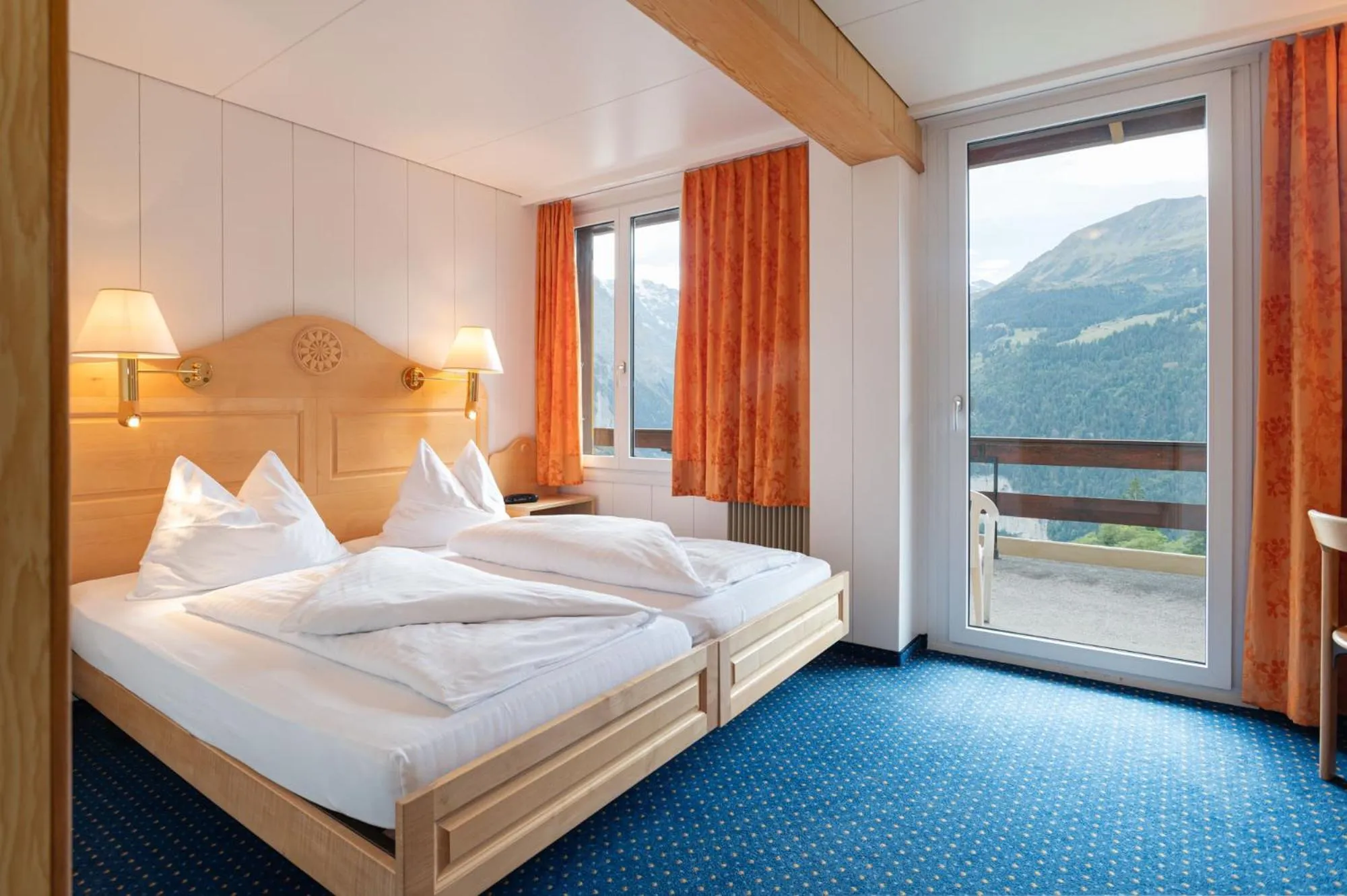 Bed in Hotel Bellevue - Traditional Swiss Hideaway