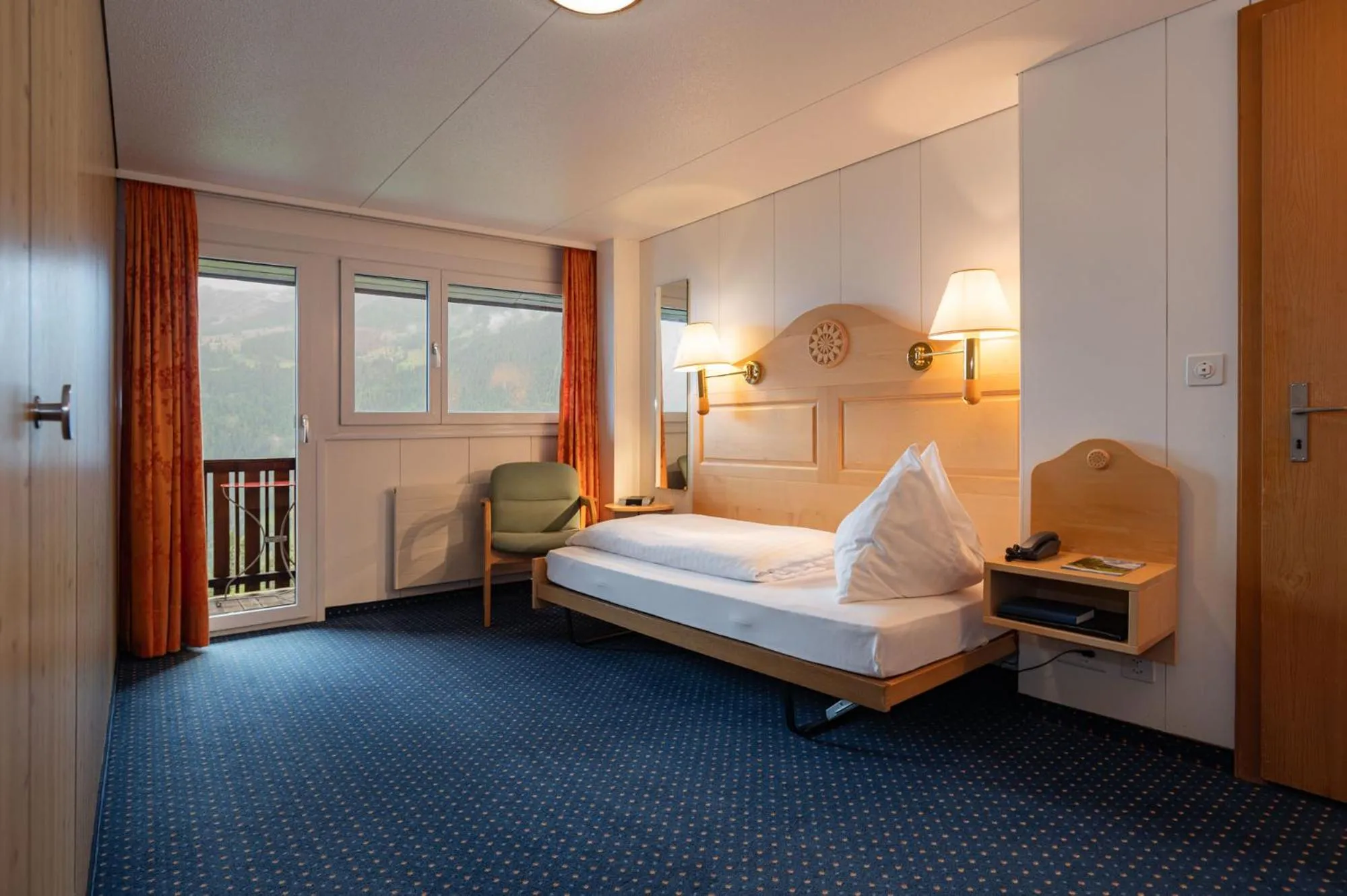 Bed in Hotel Bellevue - Traditional Swiss Hideaway