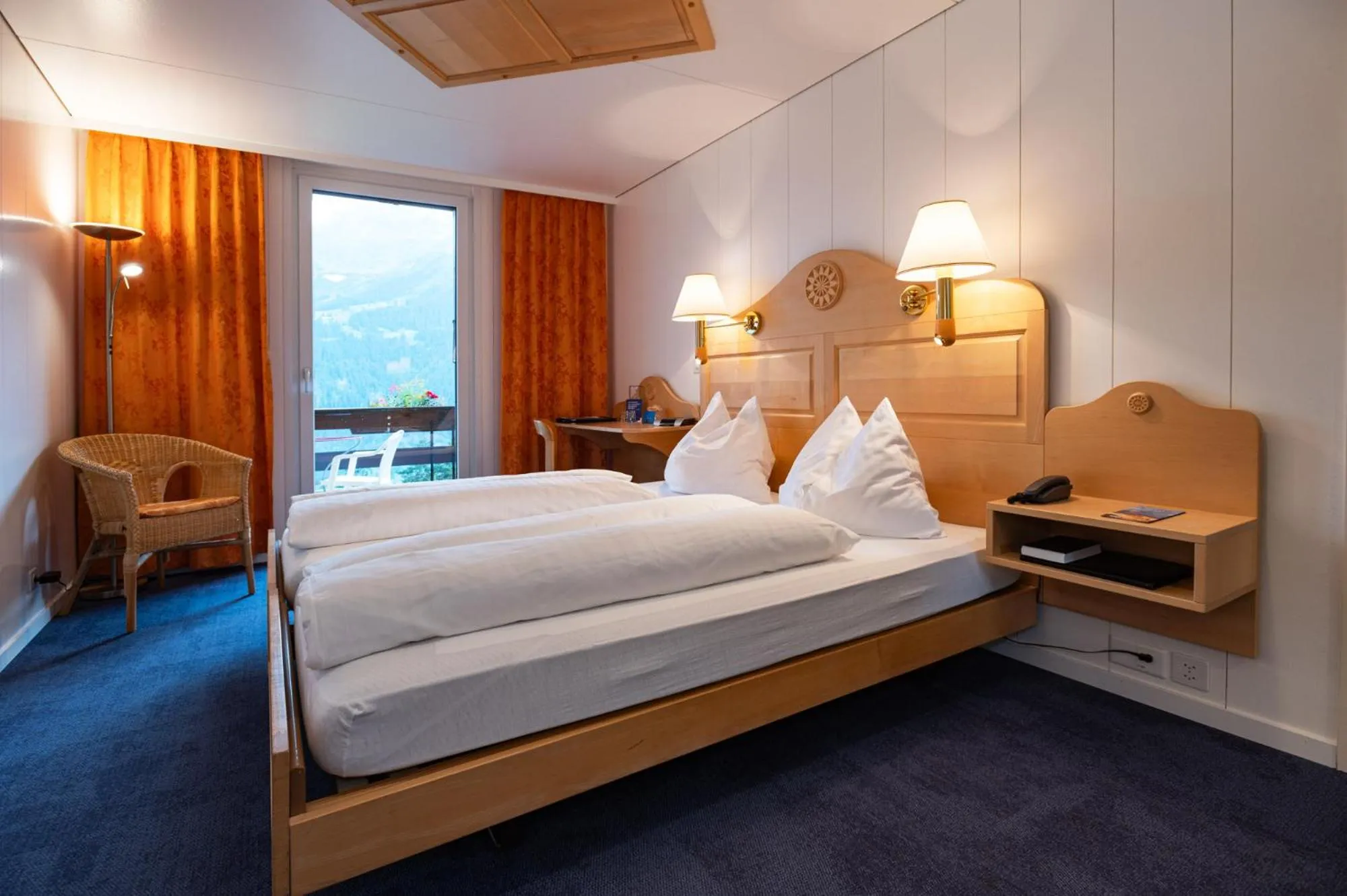 Bed in Hotel Bellevue - Traditional Swiss Hideaway