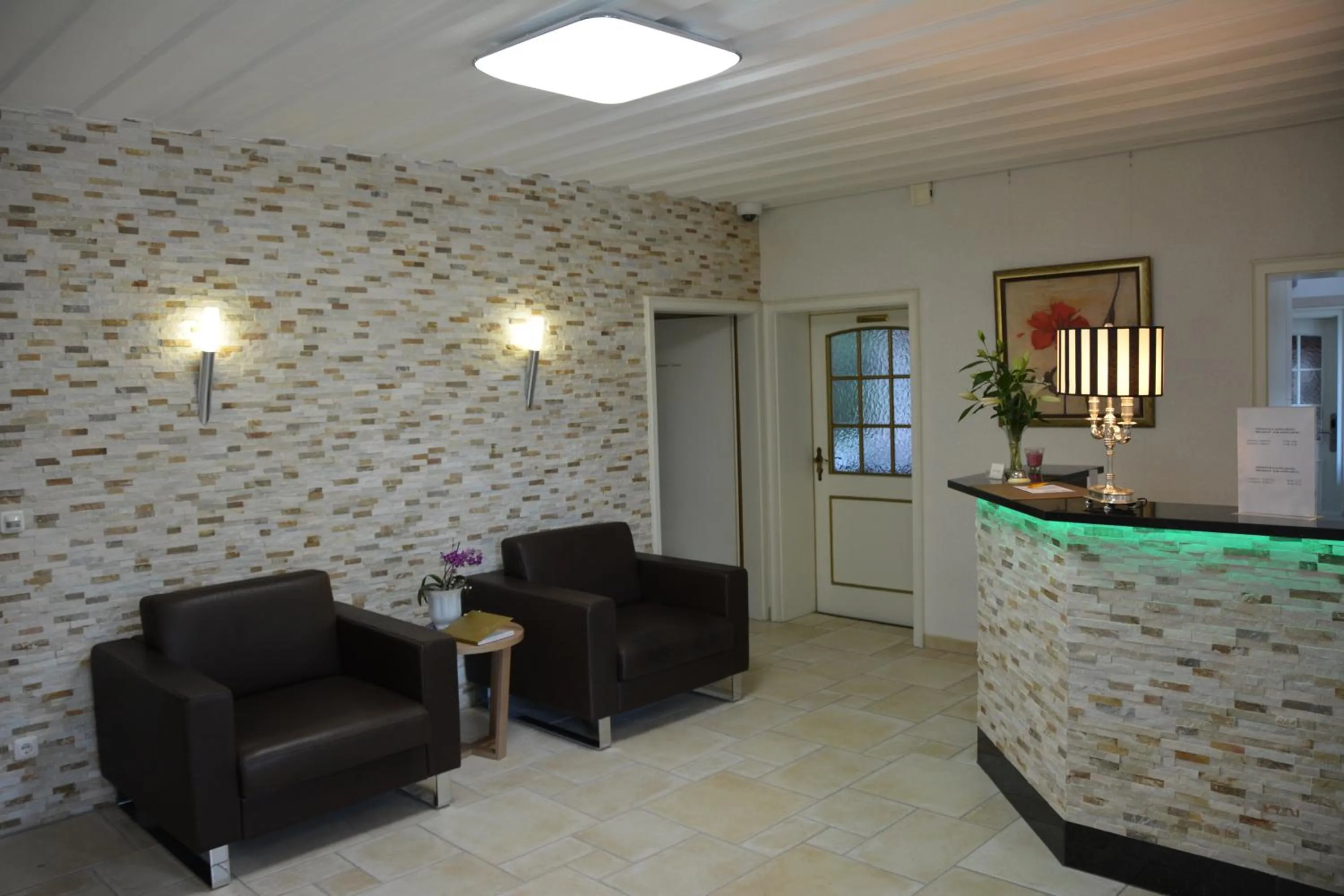 Lobby or reception in Alpina Hotel