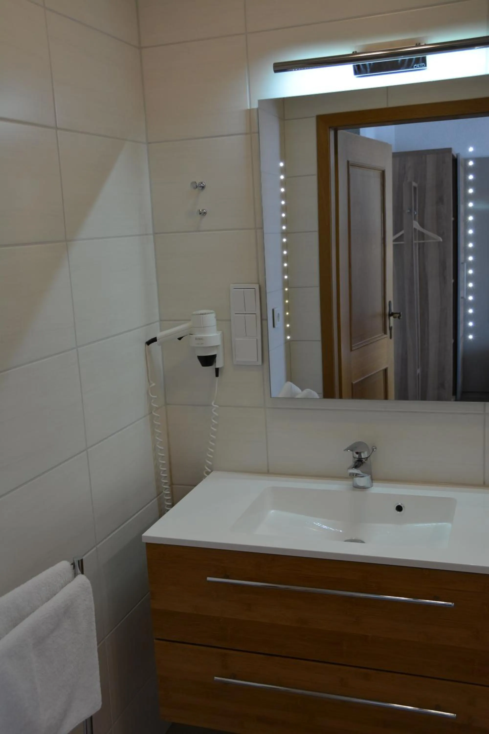 Bathroom in Alpina Hotel