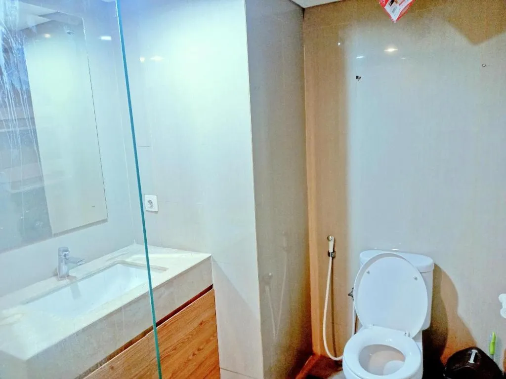 Bathroom in Cozy The H Residence Cawang by Bonzela Property